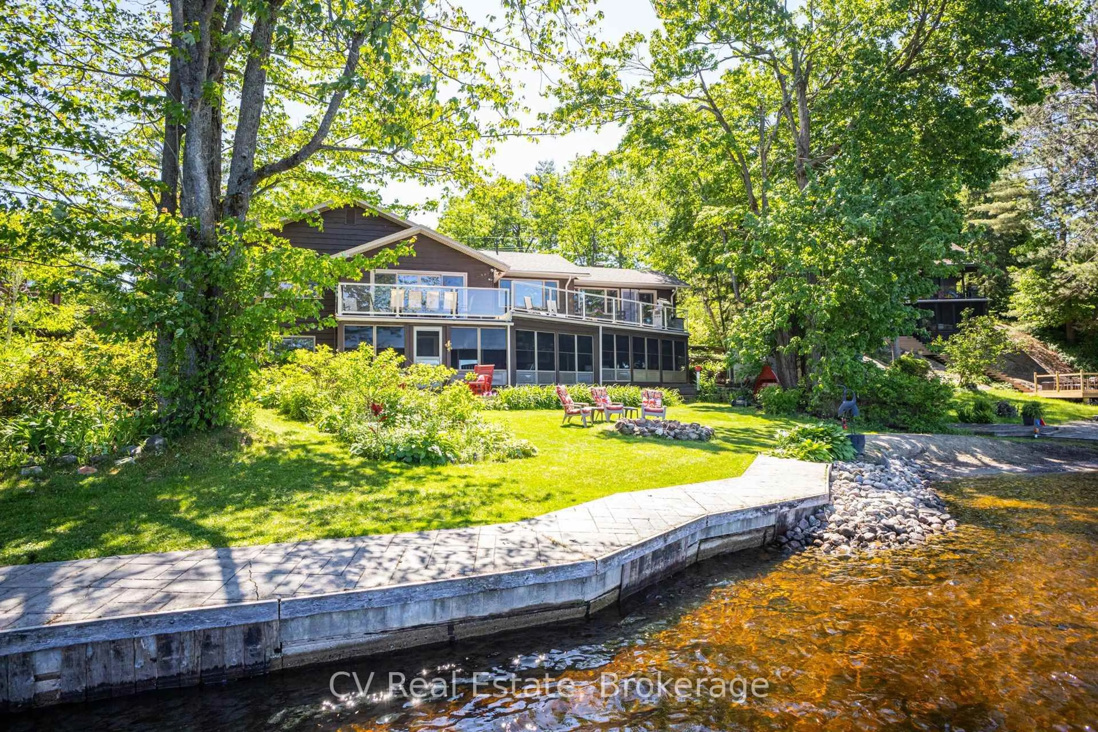 A pic from outside/outdoor area/front of a property/back of a property/a pic from drone, water/lake/river/ocean view for 1240 N Kahshe Lake Rd #Unit #2, Gravenhurst Ontario P0G 1E0