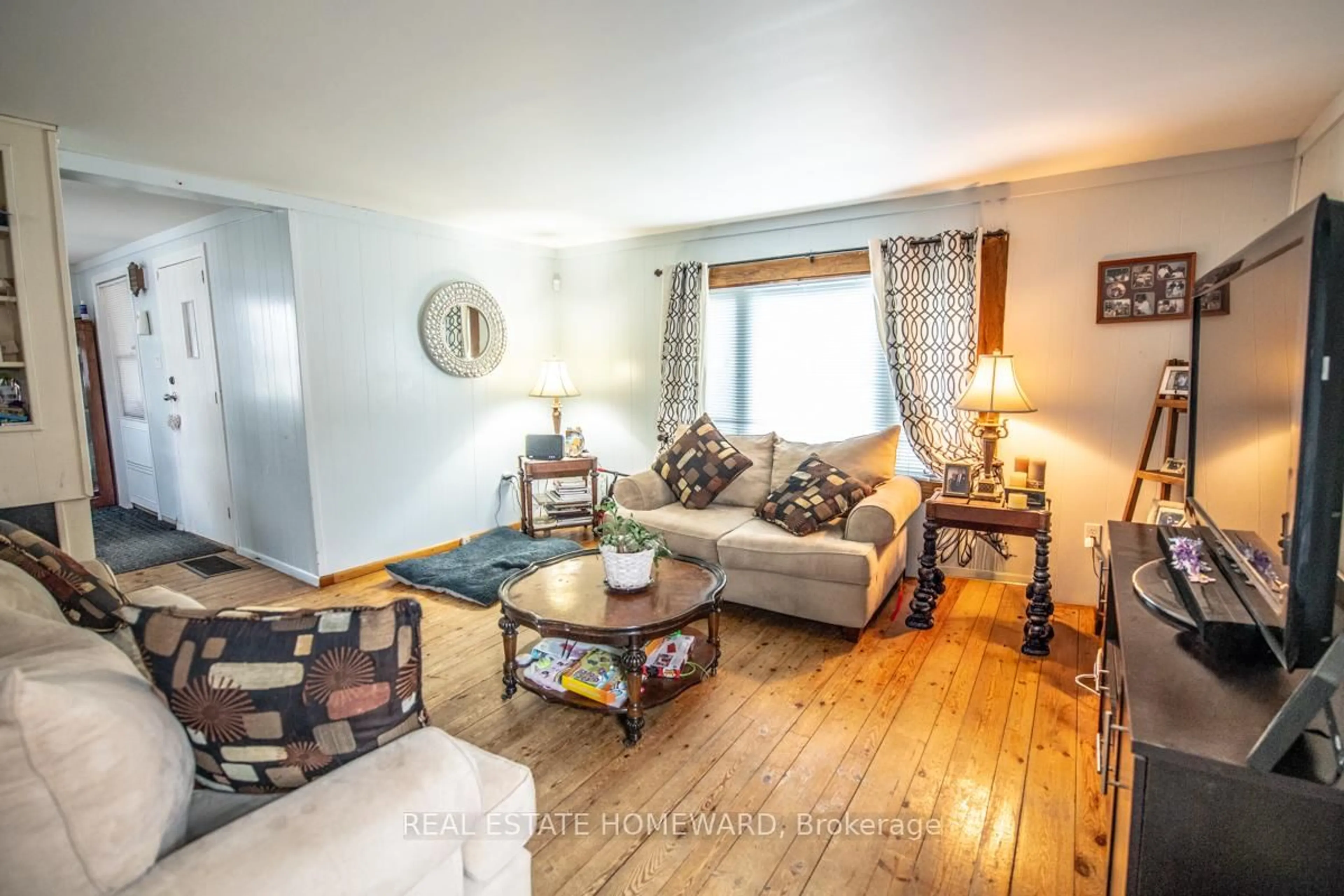 Living room with furniture, wood/laminate floor for 103 Queen St, Trent Hills Ontario K0L 1L0