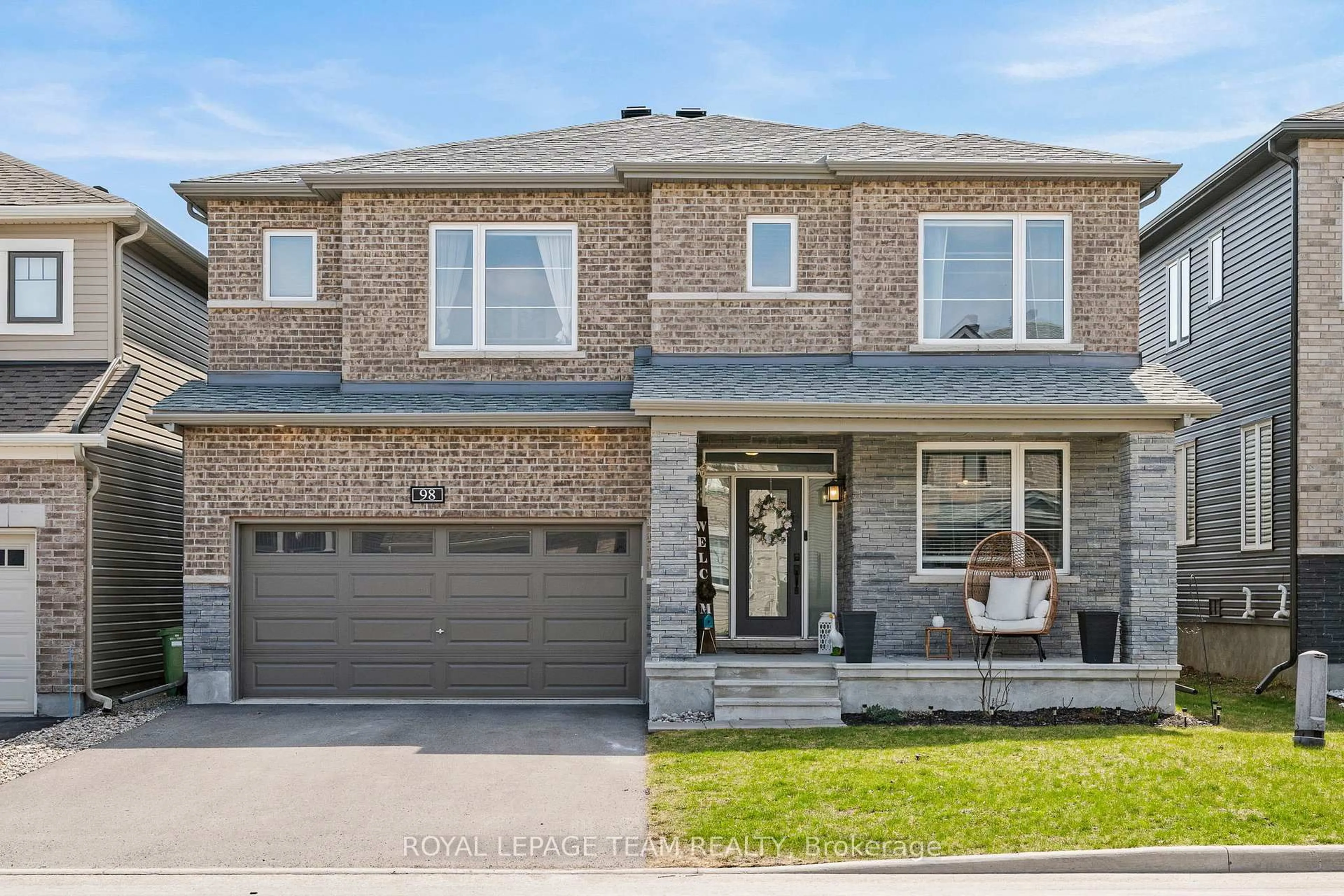Home with brick exterior material, street for 98 RALPH ERFLE Way, Ottawa Ontario K2J 6W2
