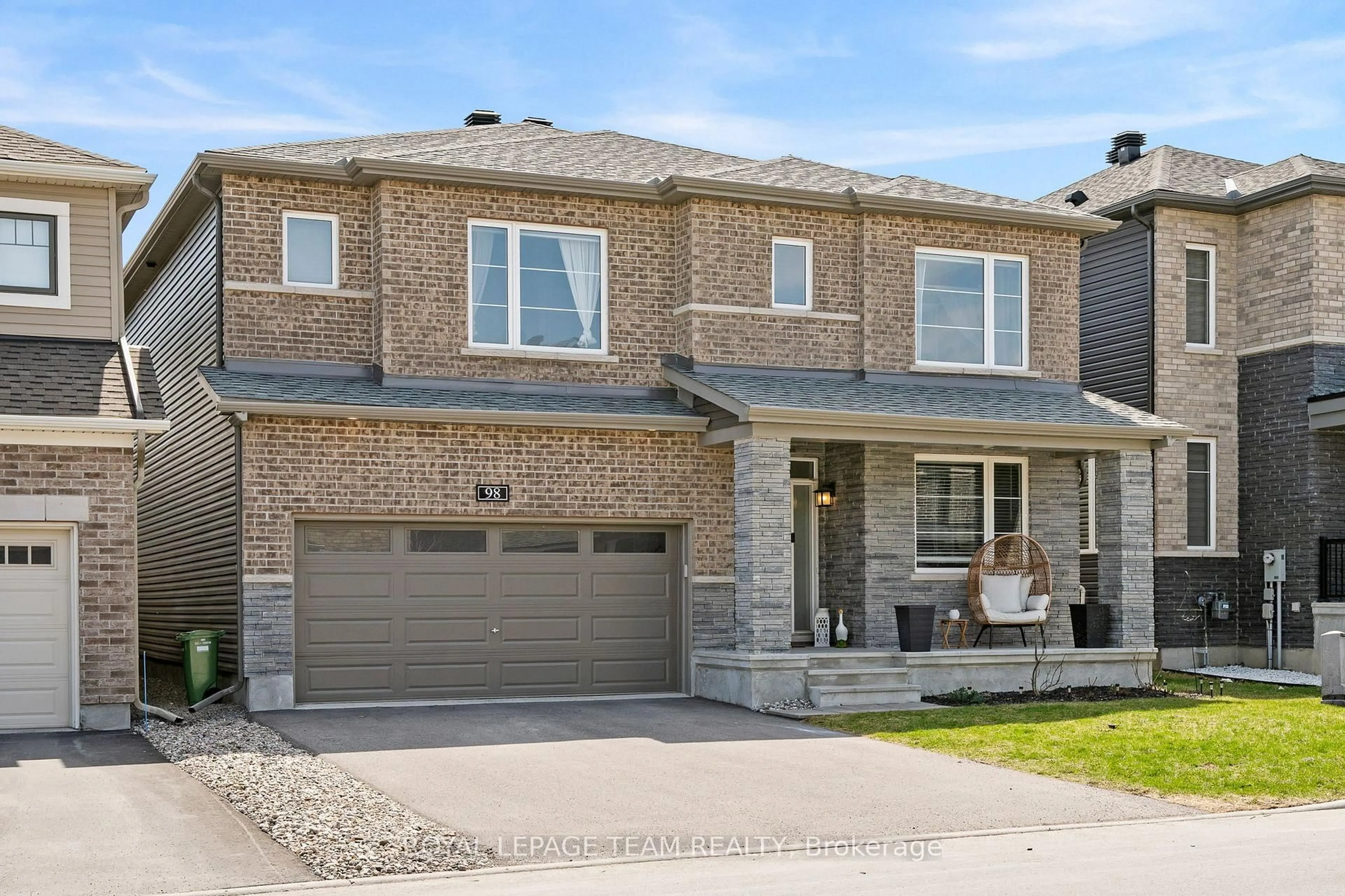 Home with brick exterior material, street for 98 RALPH ERFLE Way, Ottawa Ontario K2J 6W2