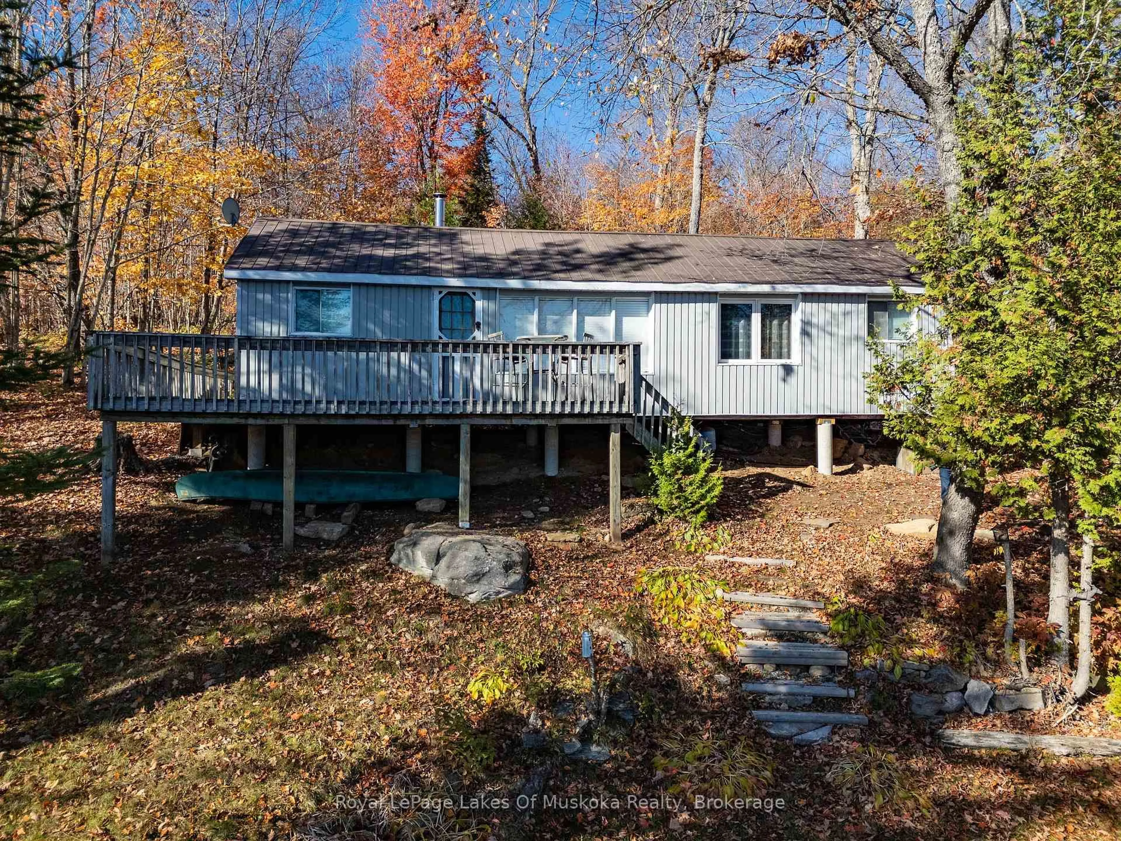 A pic from outside/outdoor area/front of a property/back of a property/a pic from drone, water/lake/river/ocean view for 1119 GRIST MILL Lane, Algonquin Highlands Ontario P0A 1E0