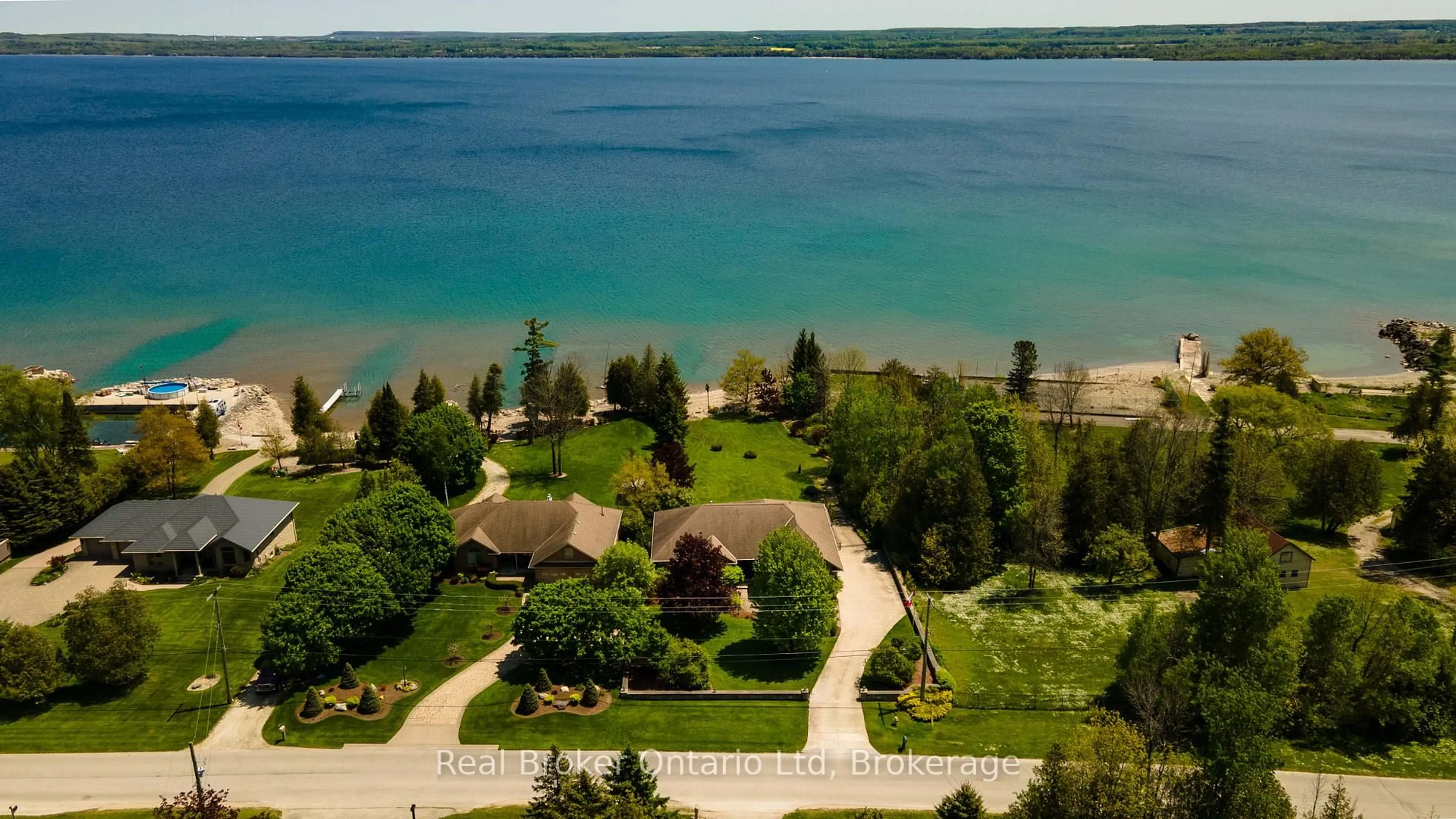 A pic from outside/outdoor area/front of a property/back of a property/a pic from drone, water/lake/river/ocean view for 361 Balmy Beach Rd, Georgian Bluffs Ontario N4K 5N4
