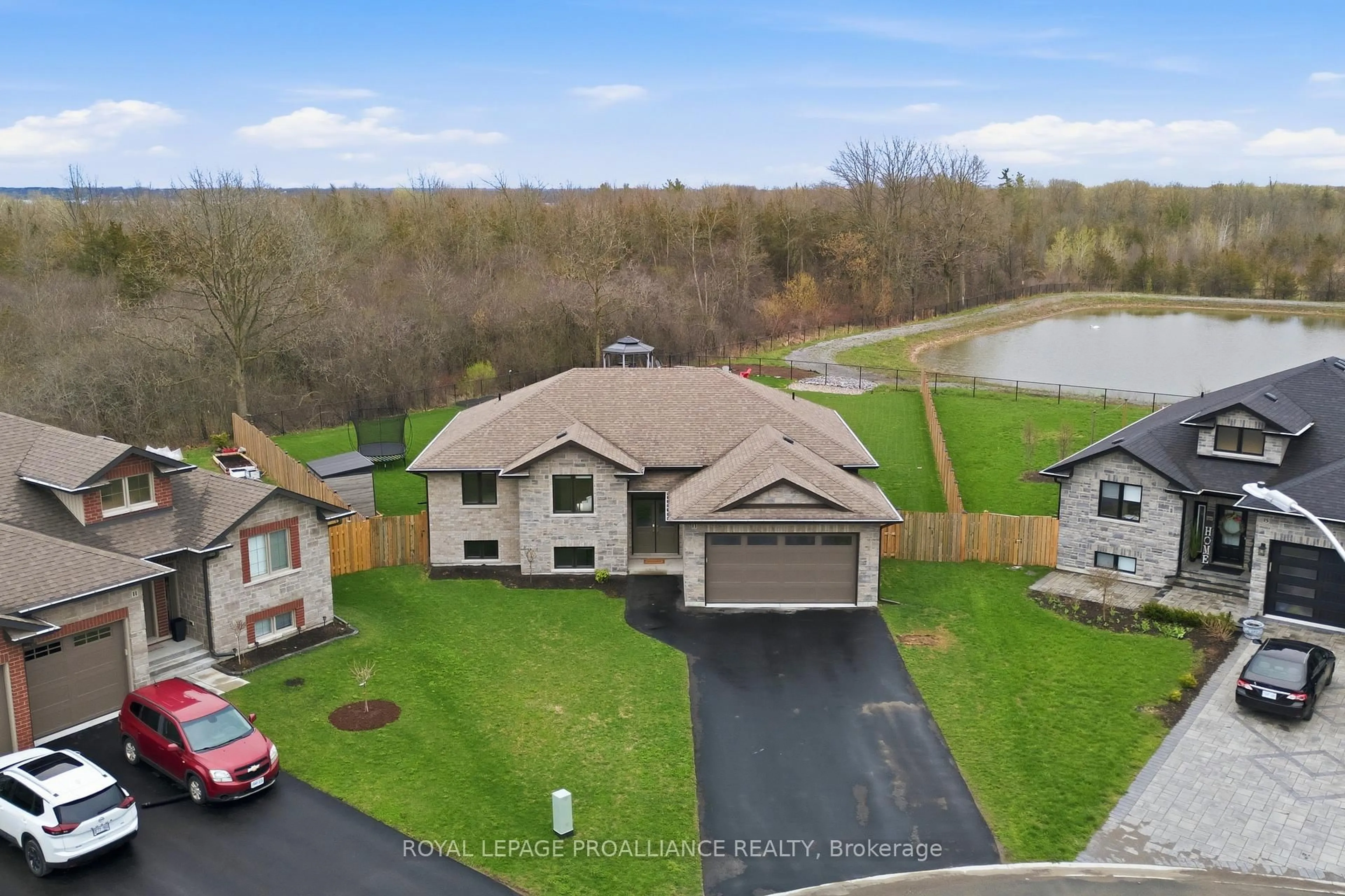 A pic from outside/outdoor area/front of a property/back of a property/a pic from drone, water/lake/river/ocean view for 13 Cattail Cres, Quinte West Ontario K8V 0J3
