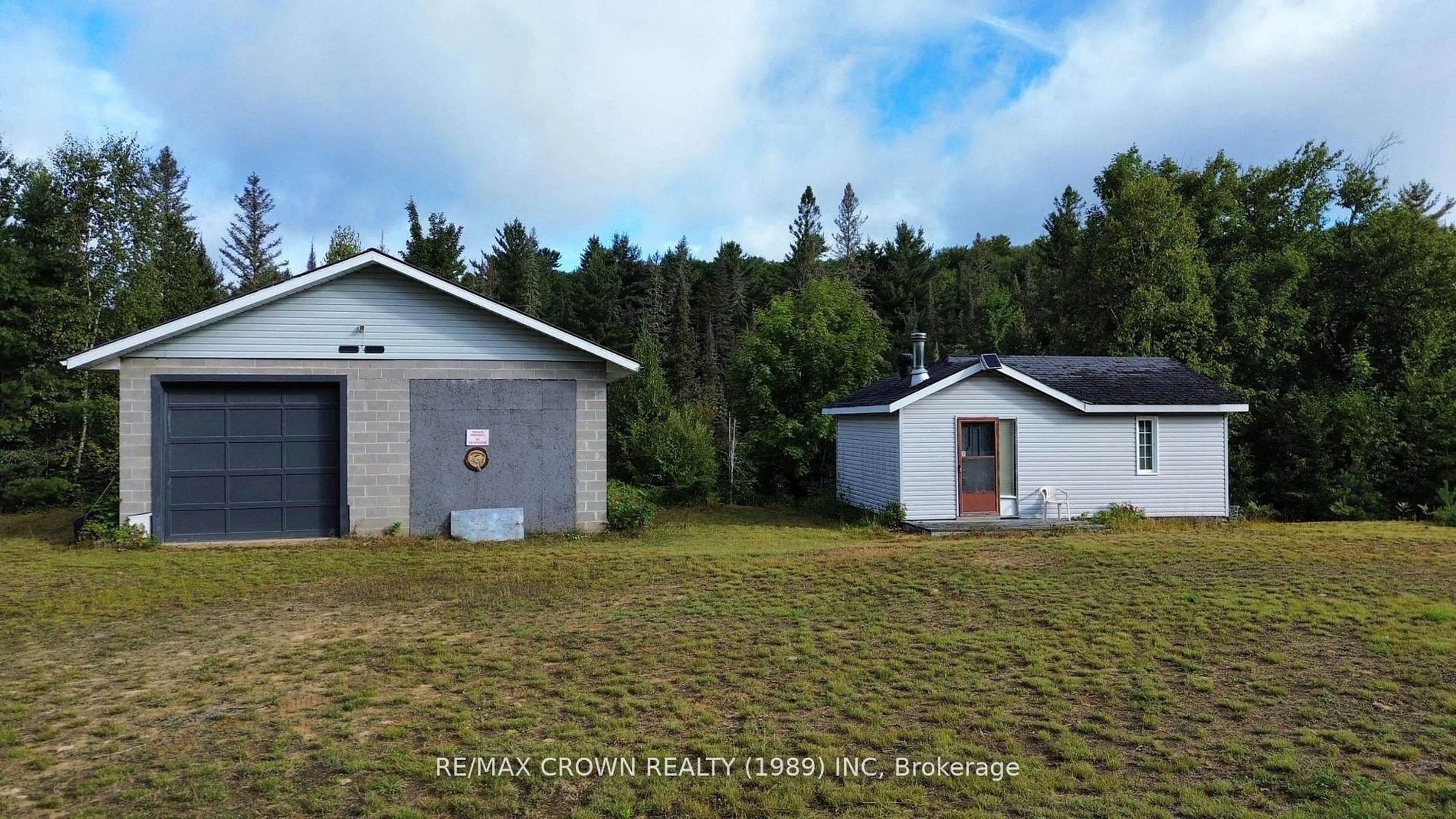 A pic from outside/outdoor area/front of a property/back of a property/a pic from drone, building for 212 Weiler Line, Powassan Ontario P0H 1L0