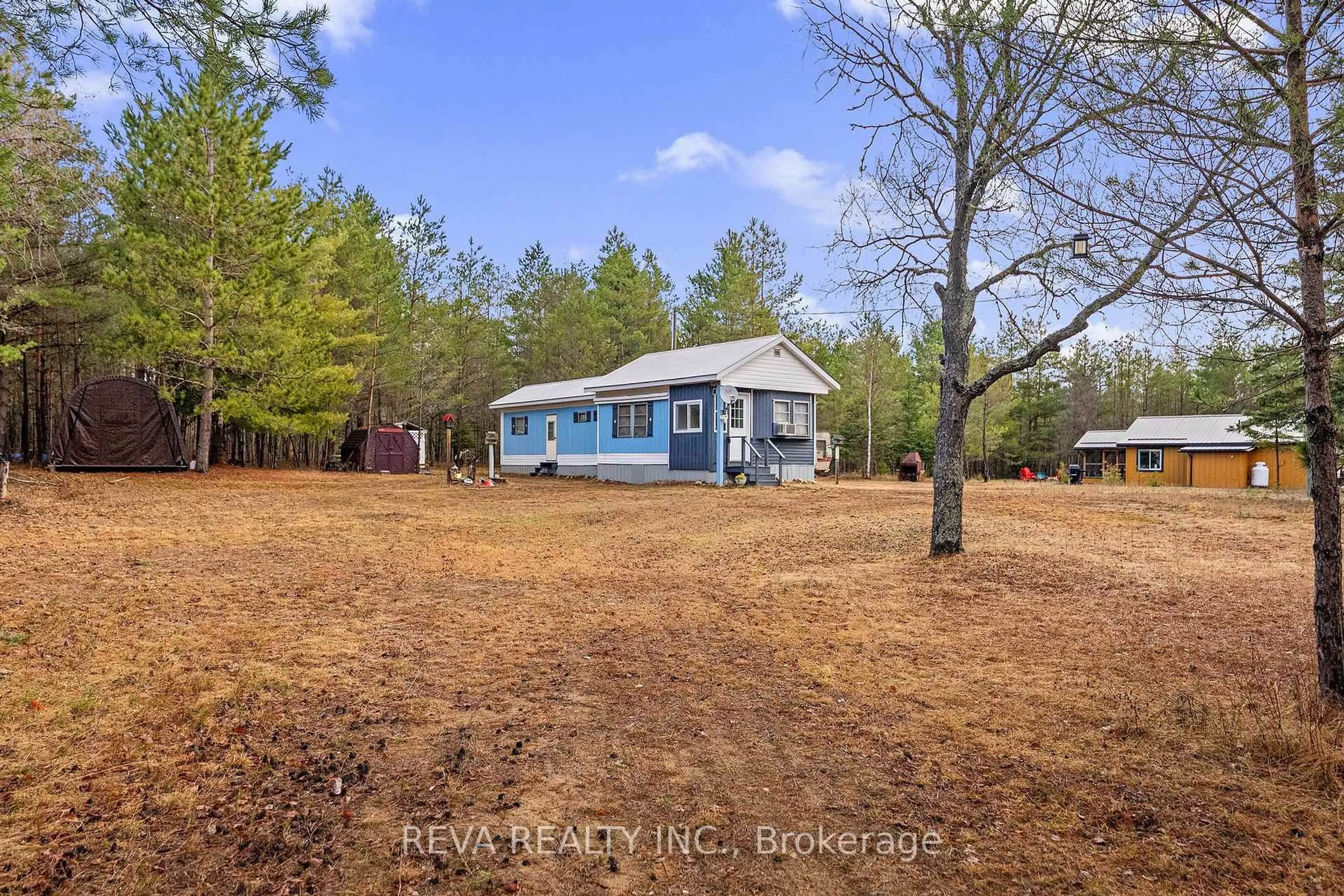 A pic from outside/outdoor area/front of a property/back of a property/a pic from drone, unknown for 15 Center Rd, Maynooth Ontario K0L 2K0
