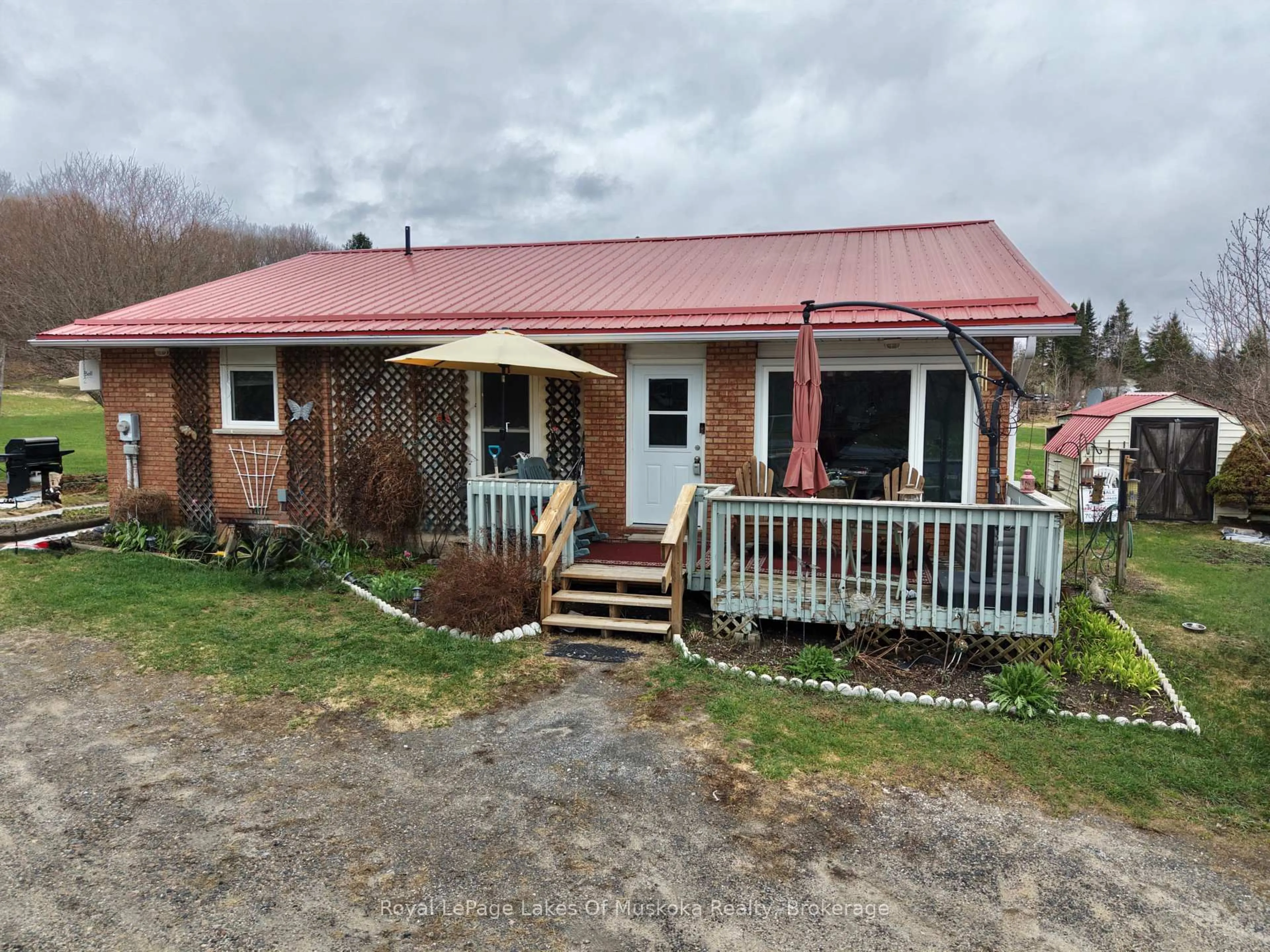 A pic from outside/outdoor area/front of a property/back of a property/a pic from drone, building for 250 Stephenson Rd 12 W Rd, Huntsville Ontario P0B 1M0