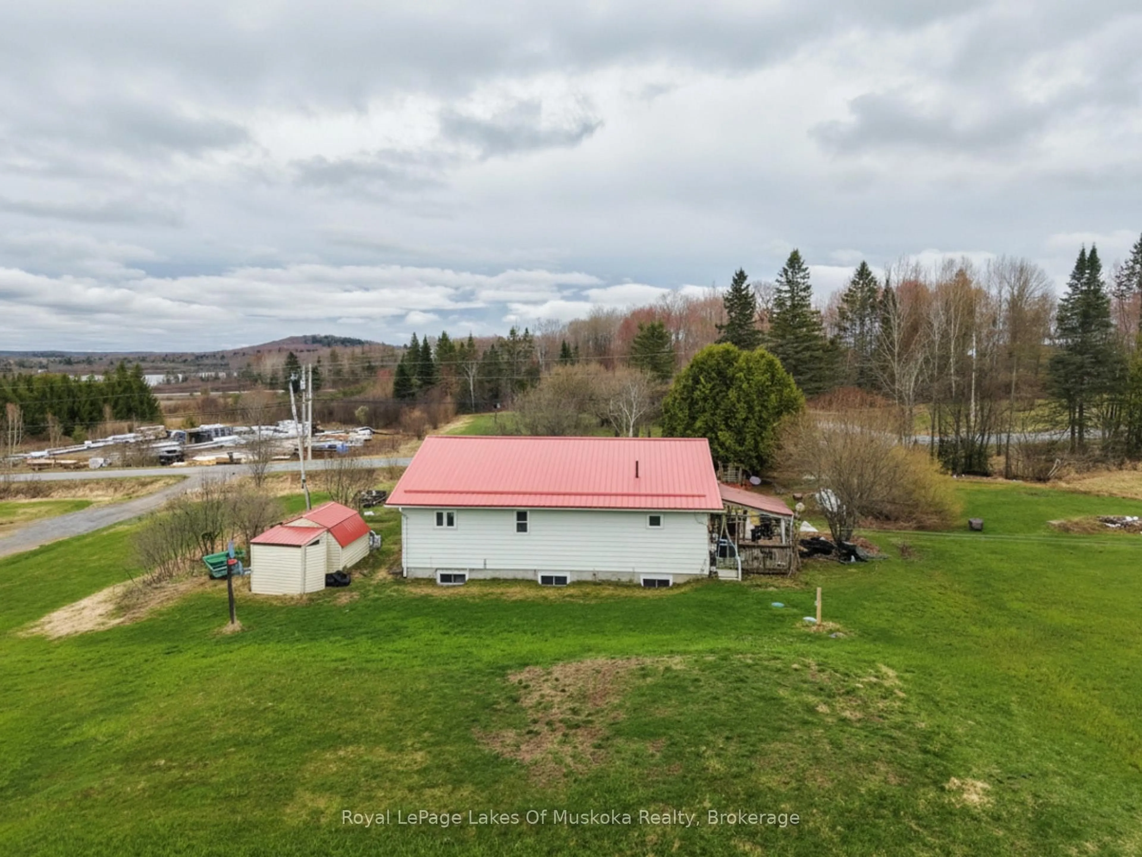 A pic from outside/outdoor area/front of a property/back of a property/a pic from drone, unknown for 250 Stephenson Rd 12 W Rd, Huntsville Ontario P0B 1M0