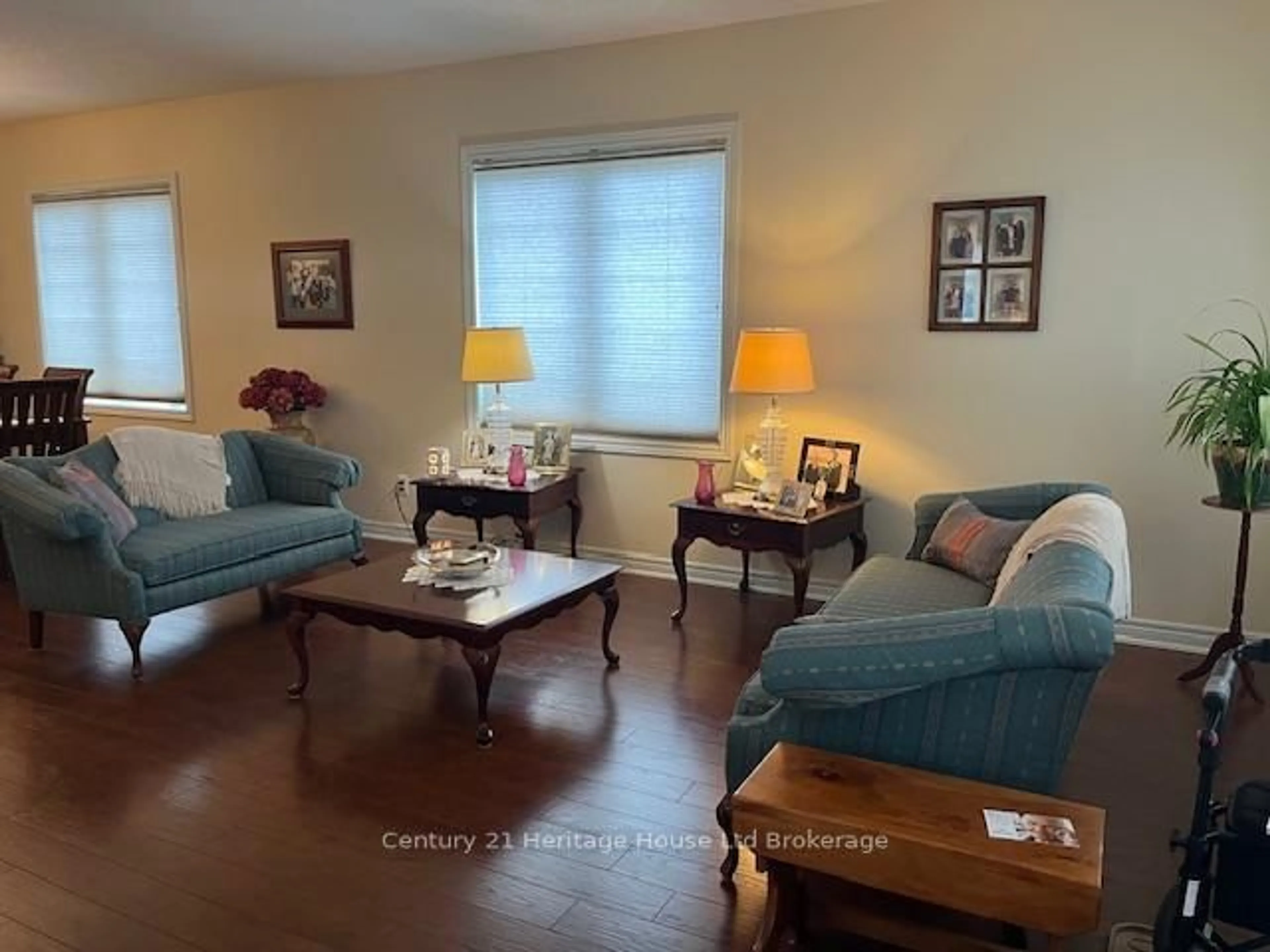 Living room with furniture, wood/laminate floor for 21 Balazs Crt #1, Tillsonburg Ontario N4G 5W6