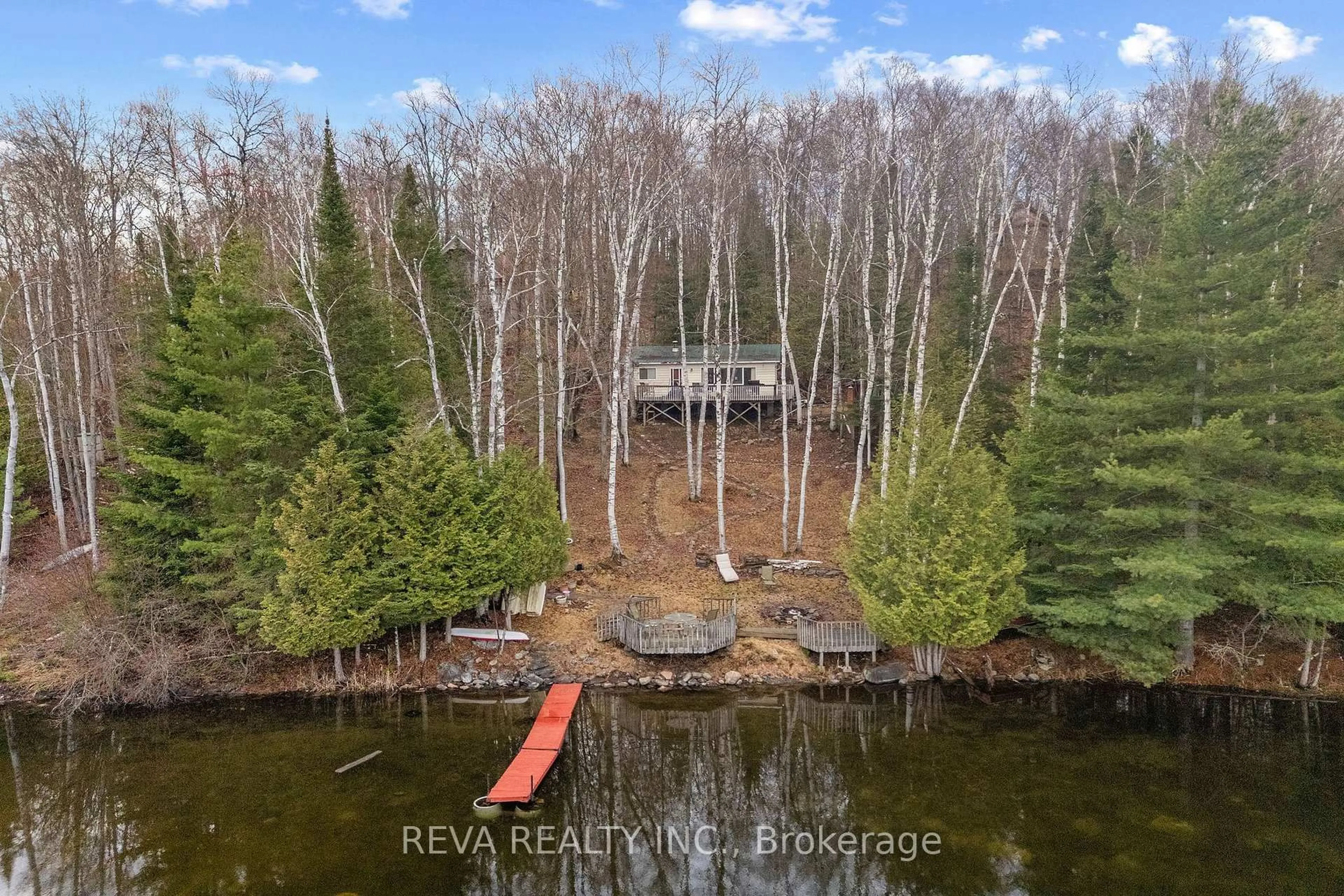 A pic from outside/outdoor area/front of a property/back of a property/a pic from drone, water/lake/river/ocean view for 115 West Mullet Lake Dr, Bancroft Ontario K0L 1C0