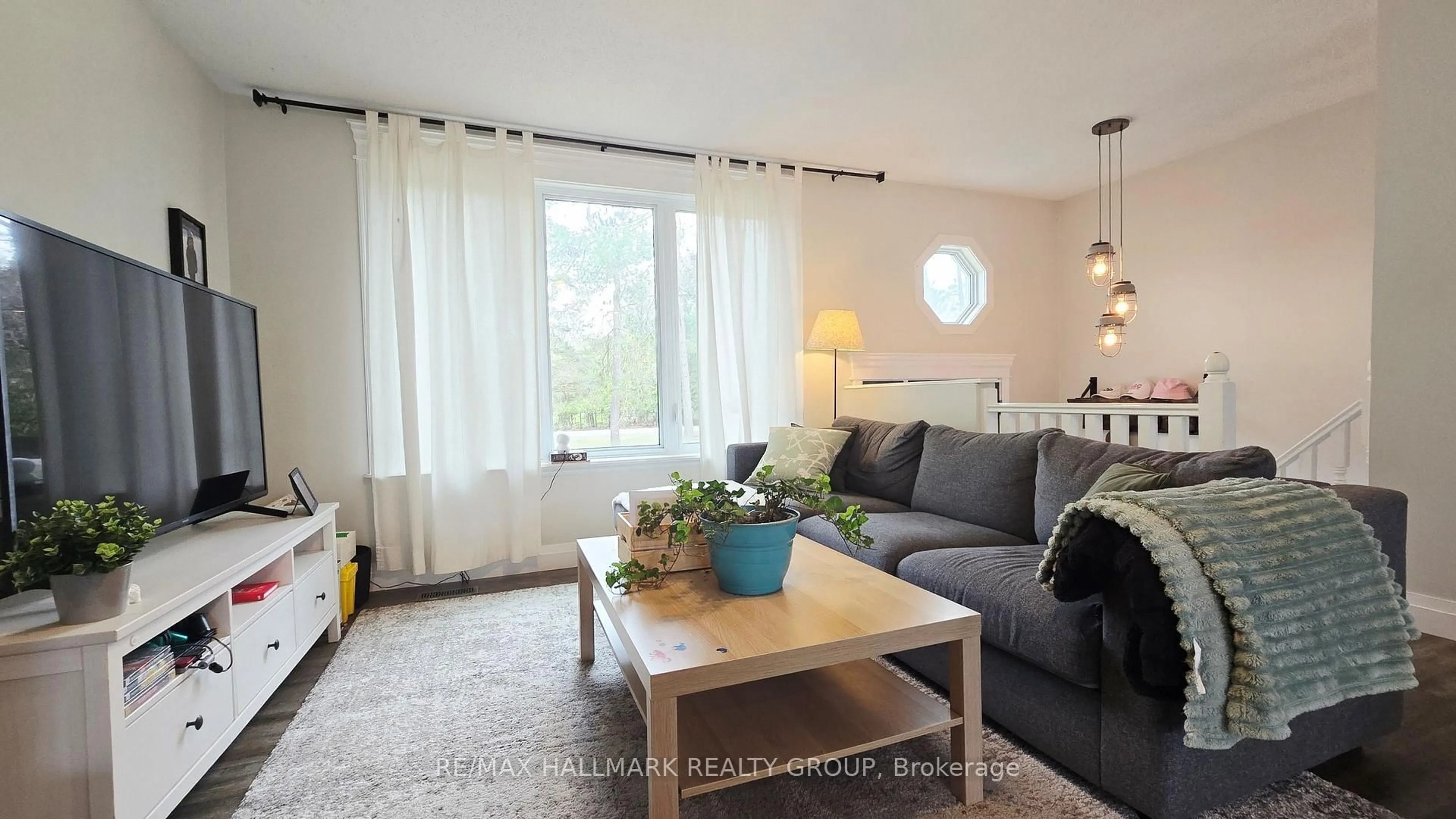 Living room with furniture, wood/laminate floor for 244 Baldwin St, Ottawa Ontario K0A 3M0