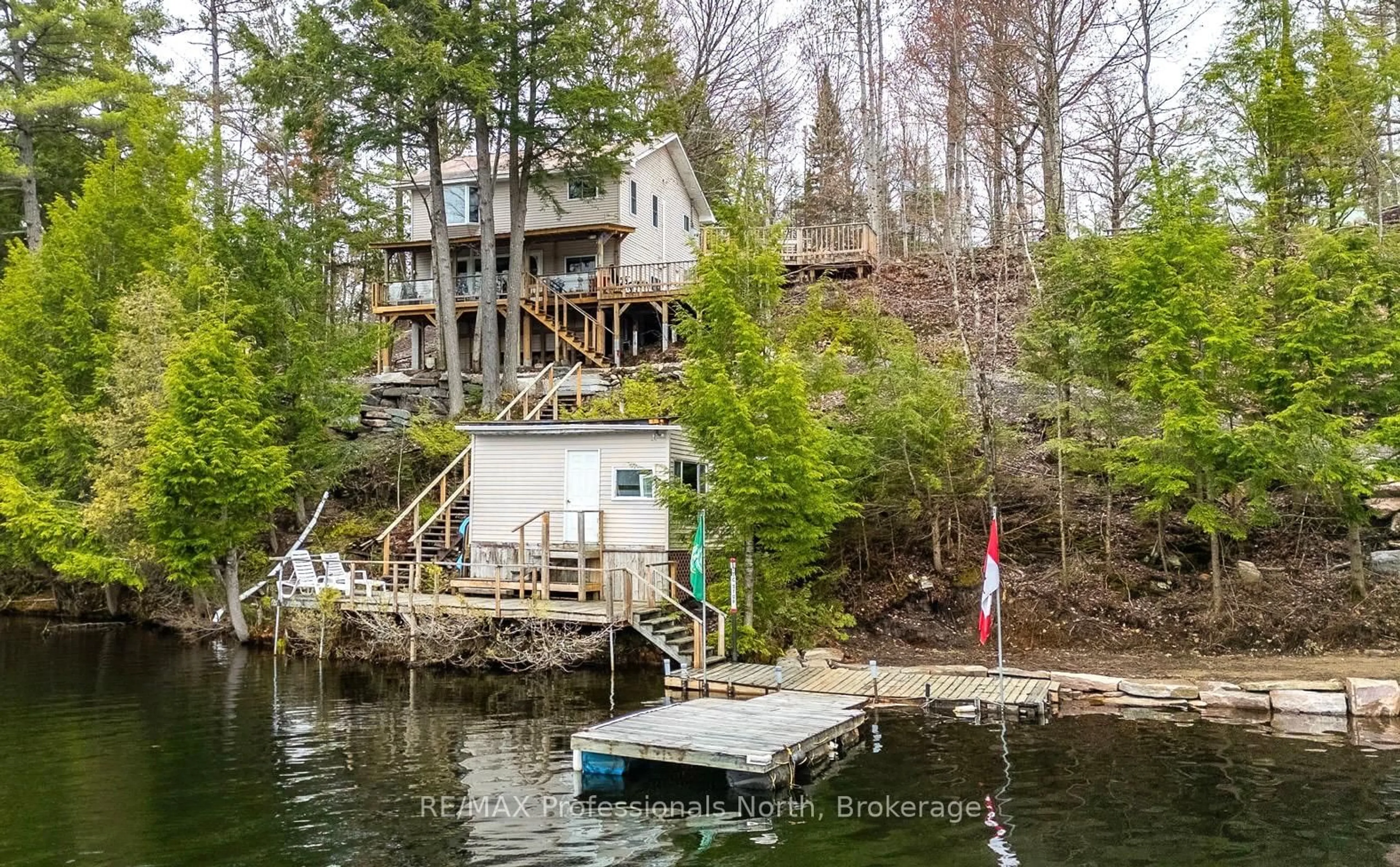 A pic from outside/outdoor area/front of a property/back of a property/a pic from drone, water/lake/river/ocean view for 1024 Ranta Tr, Minden Hills Ontario K0M 2K0