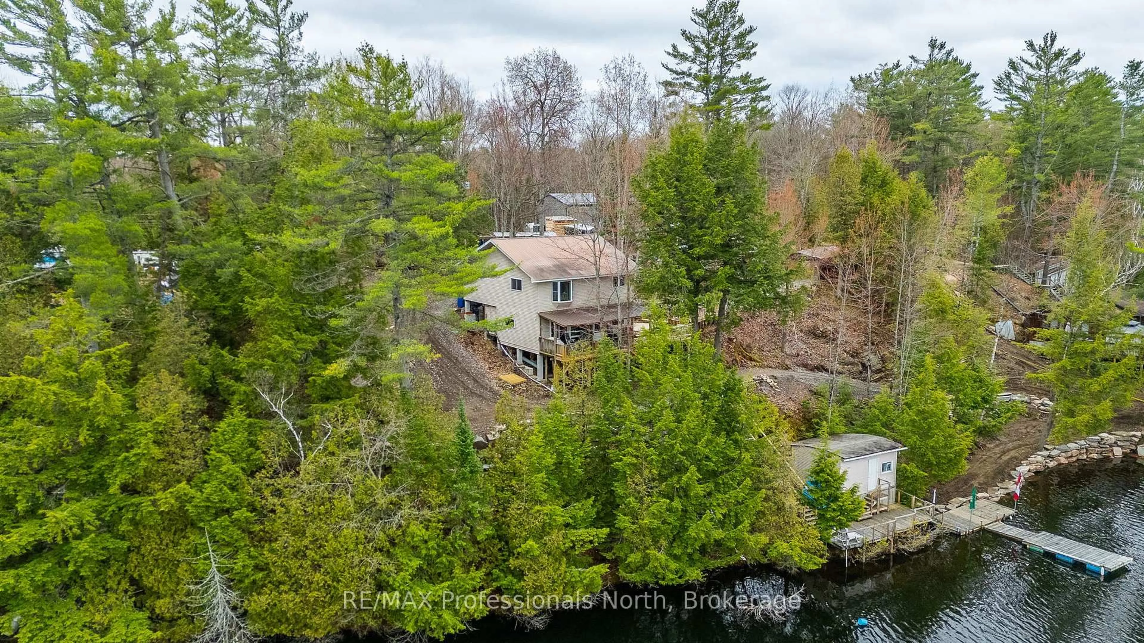 A pic from outside/outdoor area/front of a property/back of a property/a pic from drone, water/lake/river/ocean view for 1024 Ranta Tr, Minden Hills Ontario K0M 2K0
