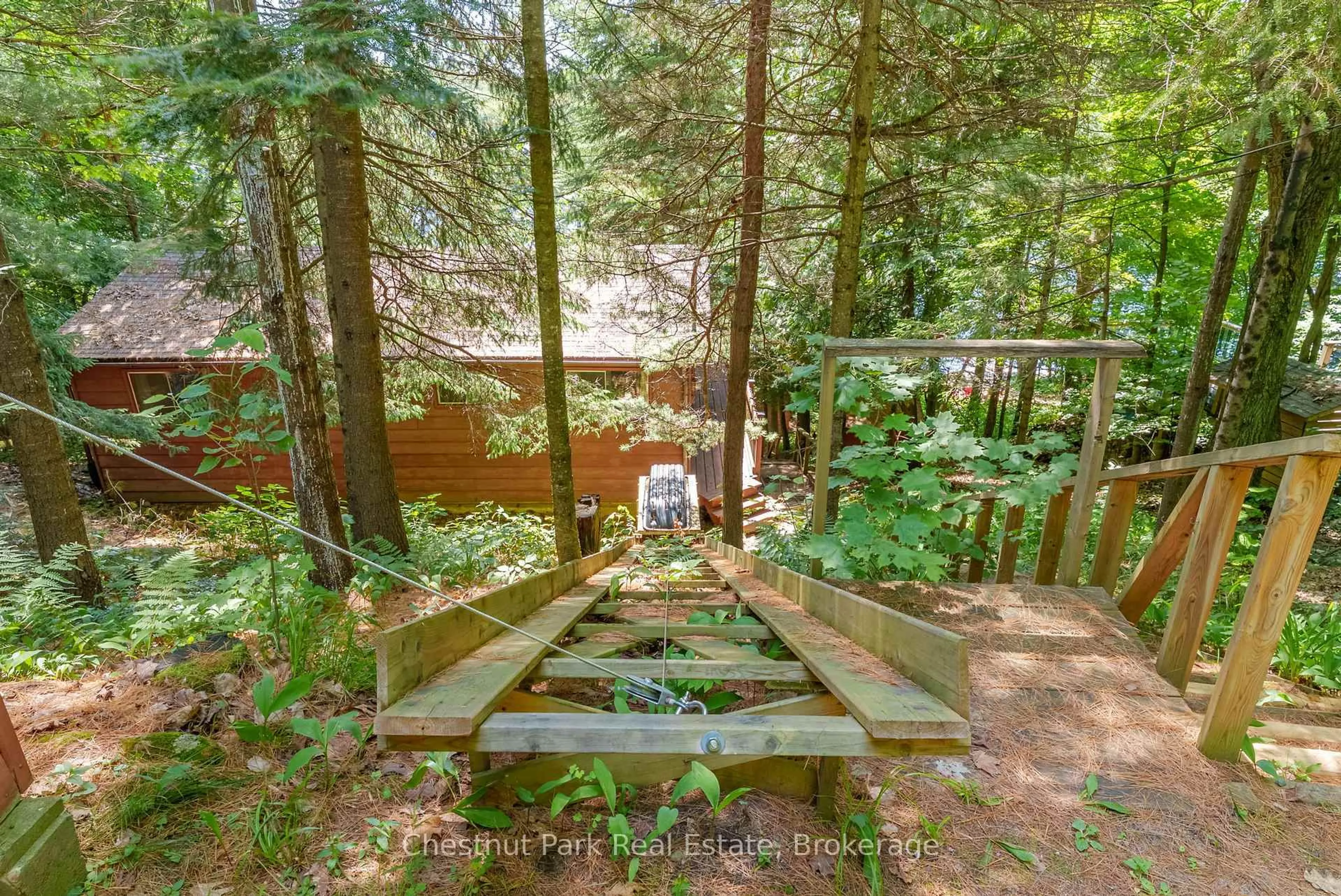 Patio, forest/trees view for 1054 10 Deewood Dr, Muskoka Lakes Ontario P0B 1M0