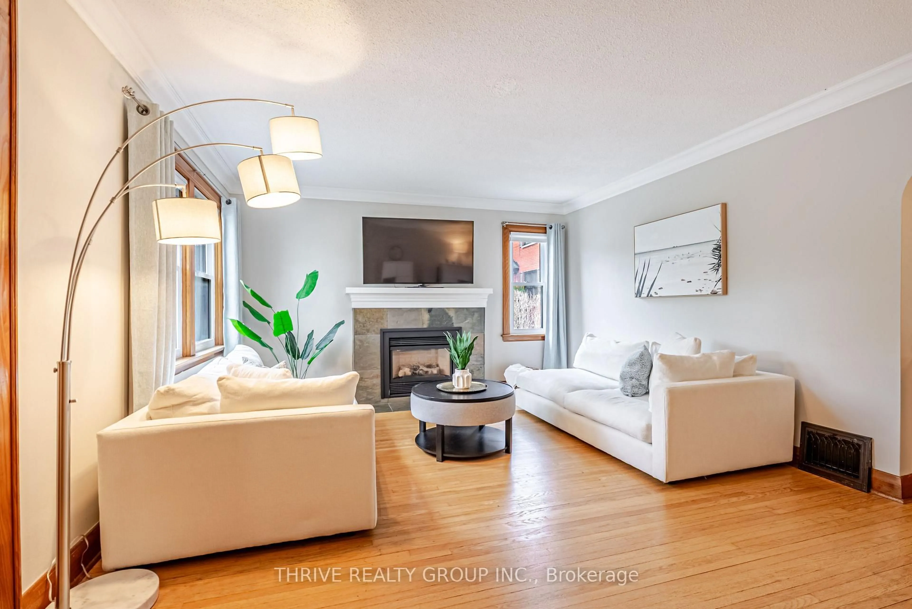 Living room with furniture, wood/laminate floor for 79 Base Line Rd, London South Ontario N6C 2N6