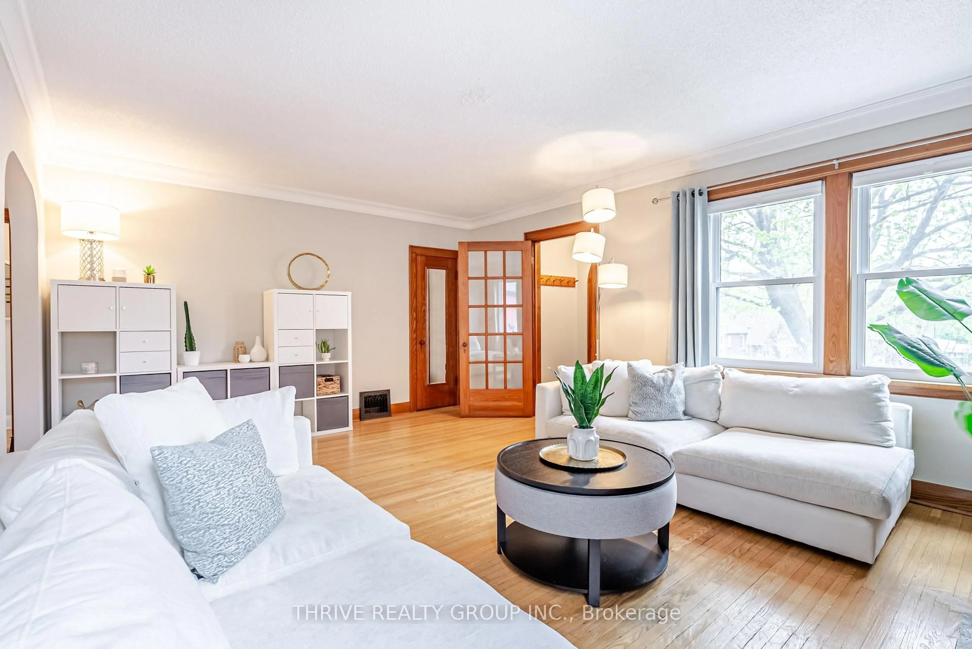 Living room with furniture, wood/laminate floor for 79 Base Line Rd, London South Ontario N6C 2N6