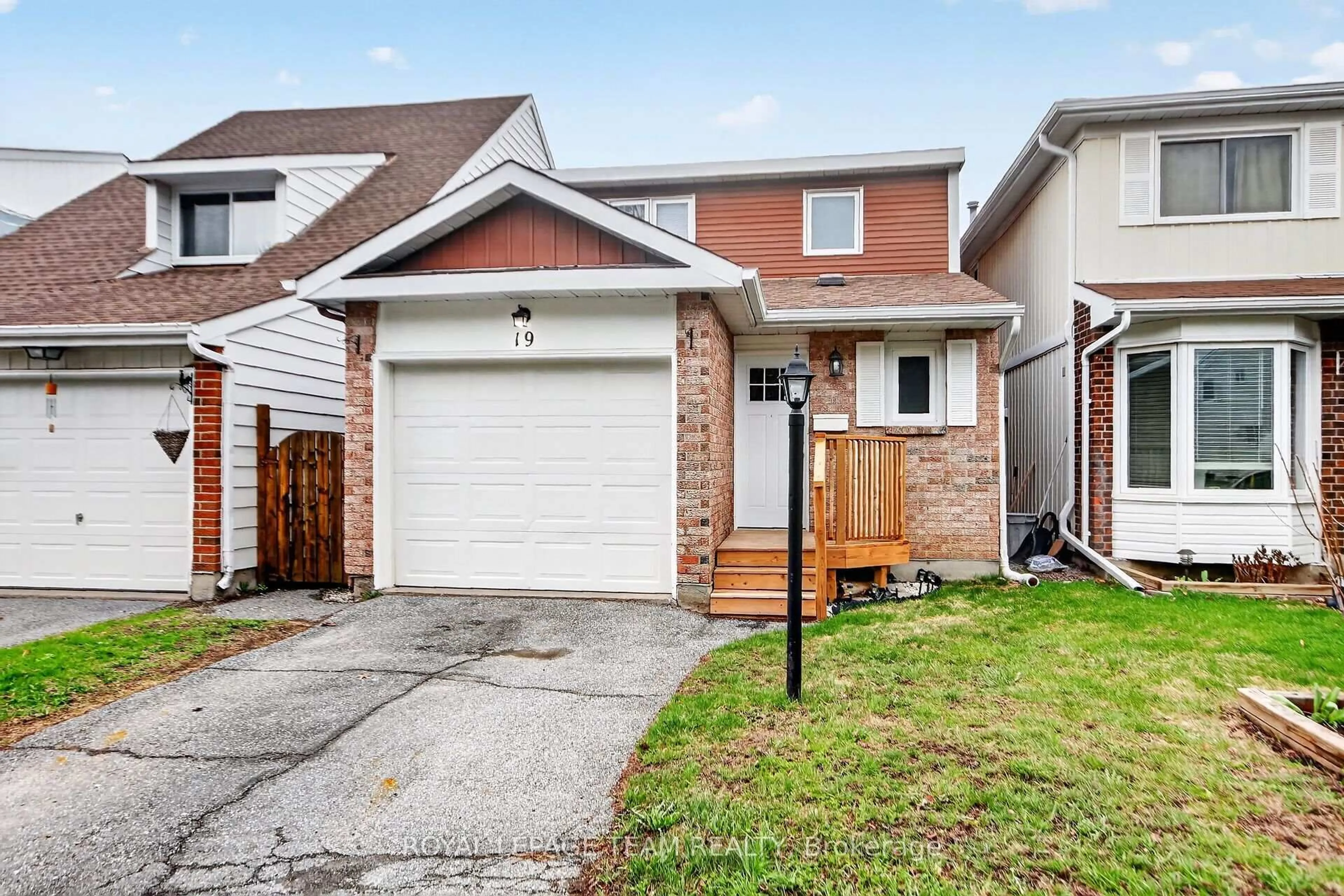 Home with vinyl exterior material, street for 19 Trafford Lane #14, Barrhaven Ontario K2J 1X6