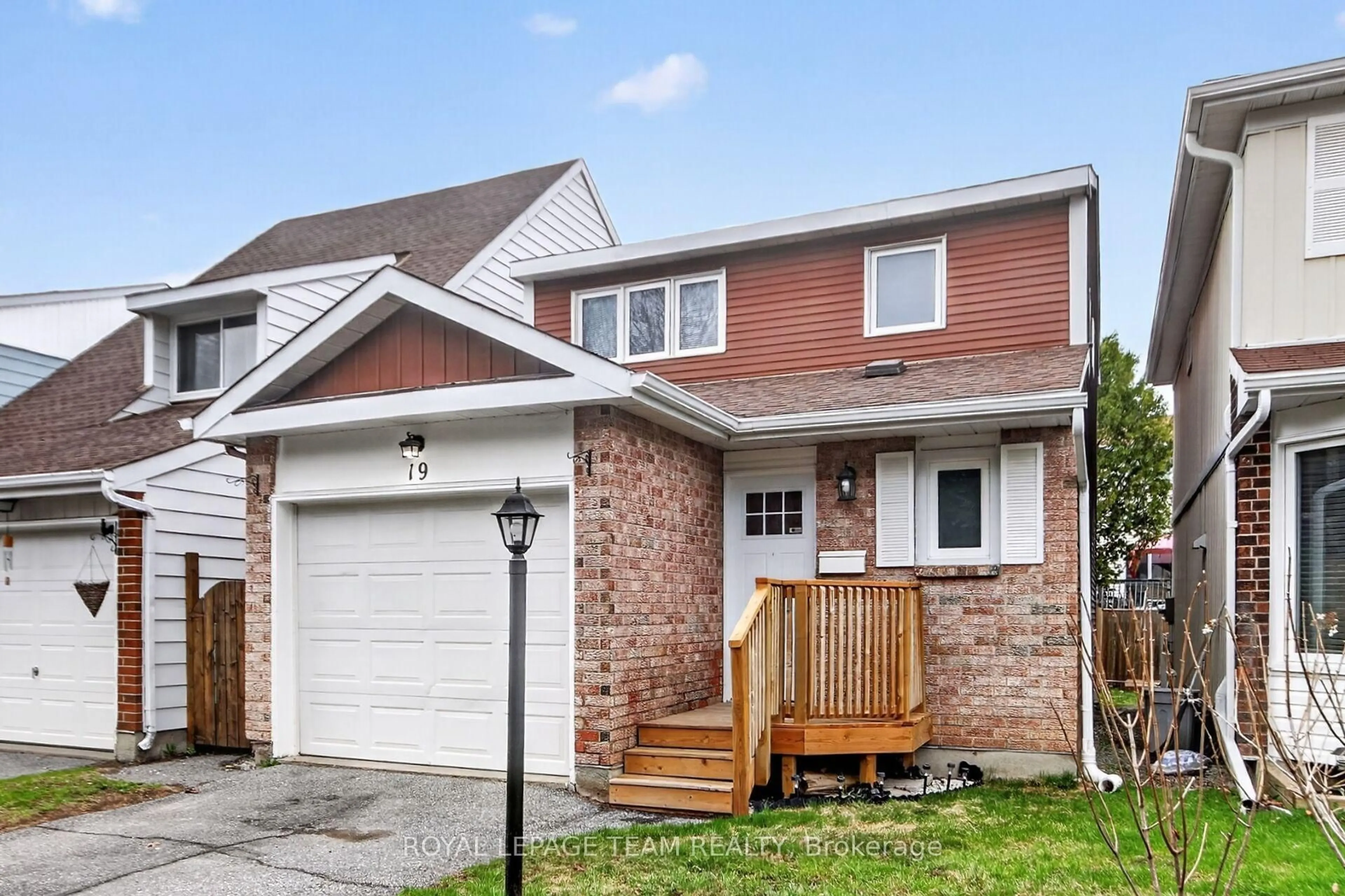 Home with brick exterior material, street for 19 Trafford Lane #14, Barrhaven Ontario K2J 1X6