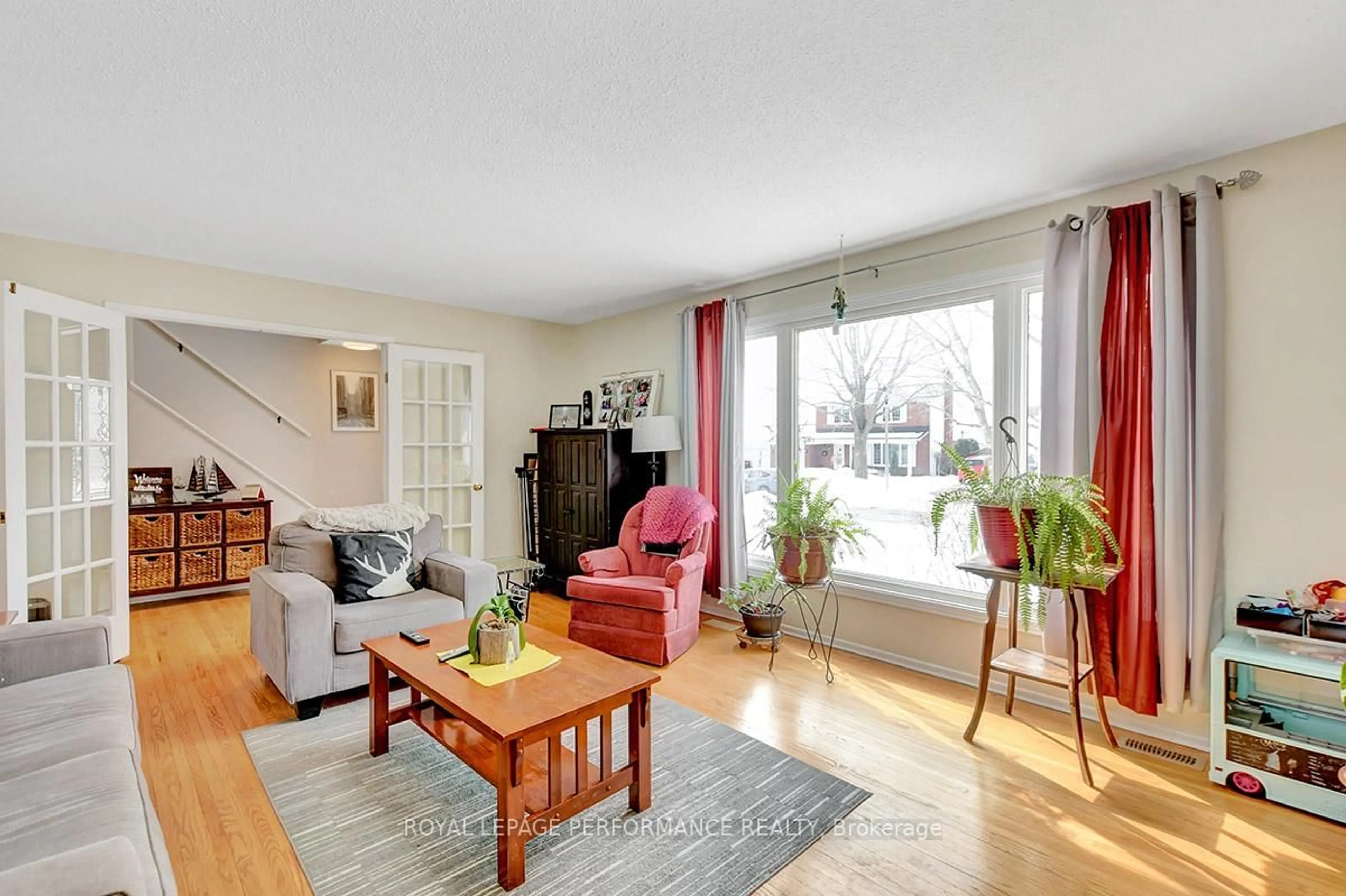 Living room with furniture, wood/laminate floor for 122 Post Rd, Ottawa Ontario K2L 1L2