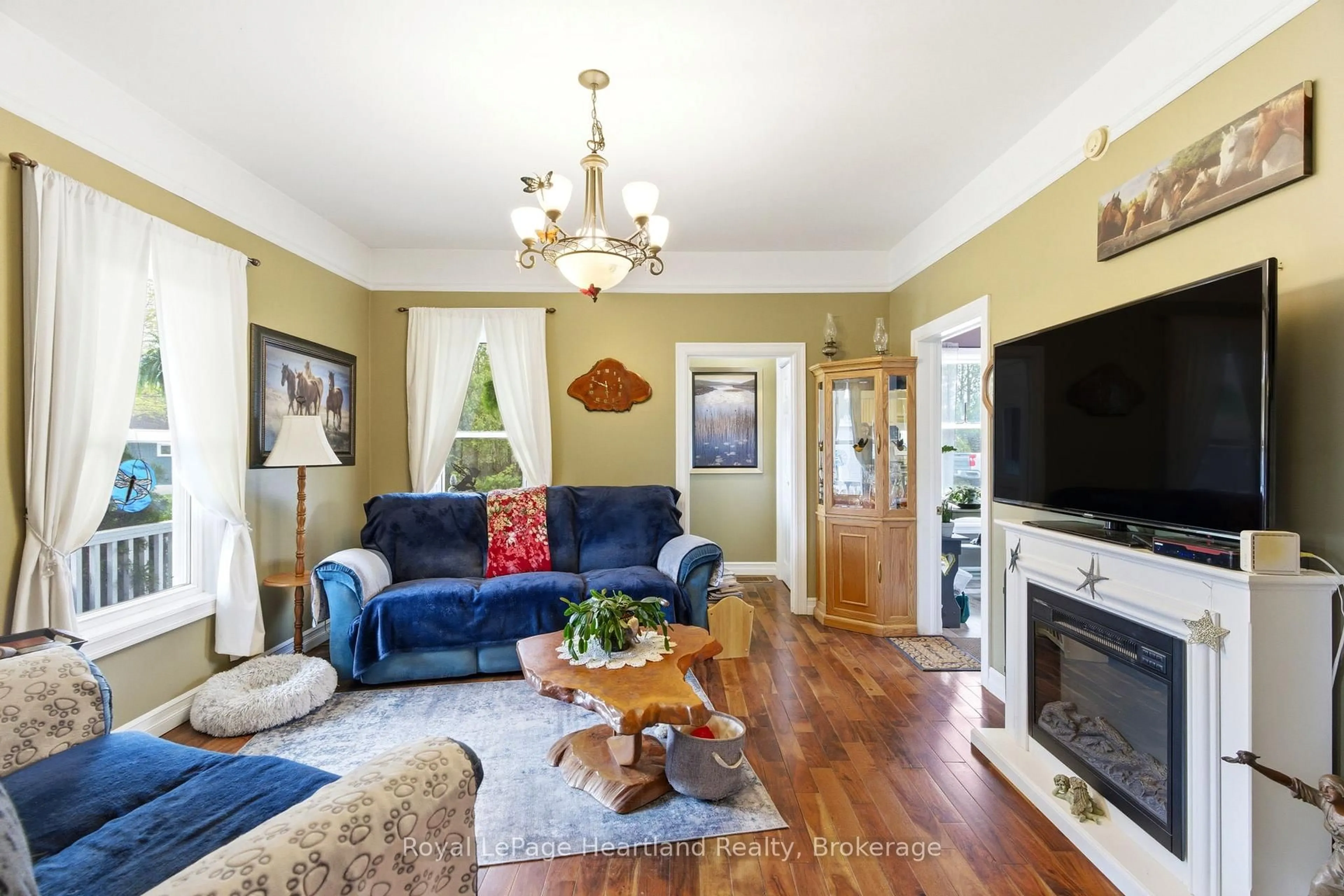 Living room with furniture, wood/laminate floor for 125 Johns Ave, Central Huron Ontario N0M 1E0