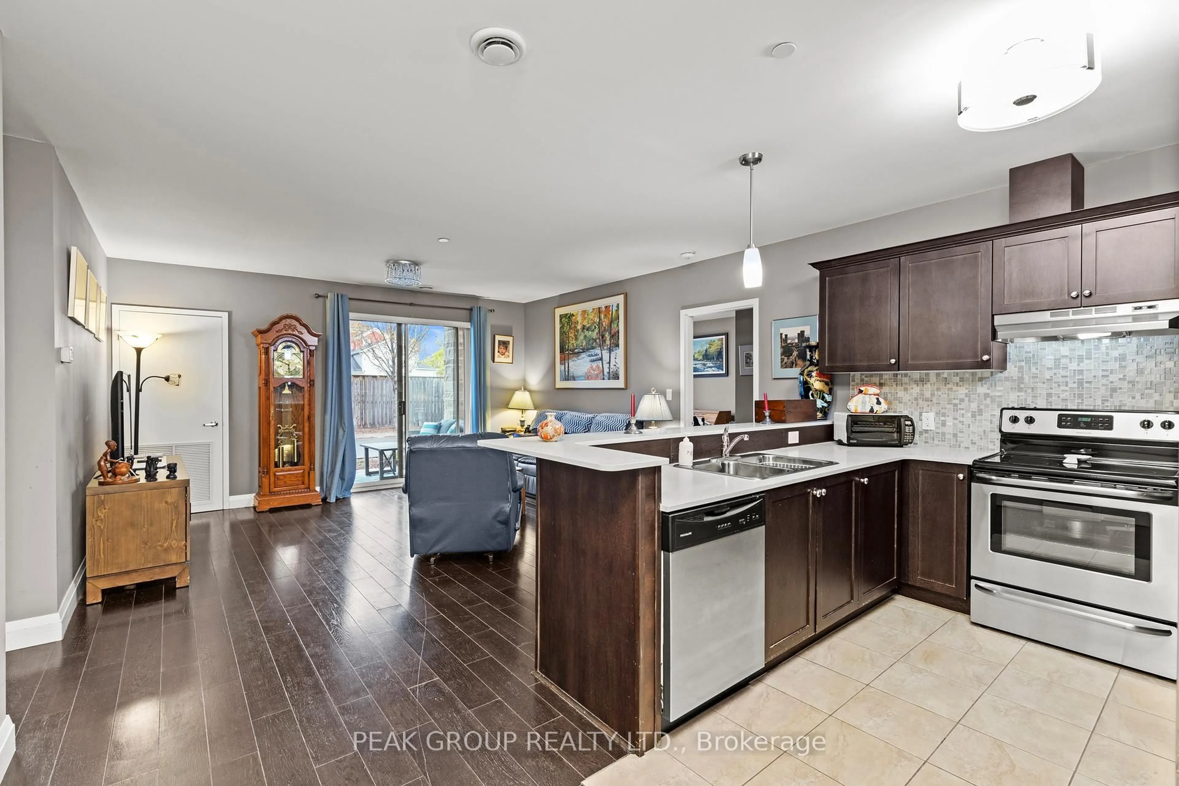 Open concept kitchen, ceramic/tile floor for 26 Wellington St #106, St. Catharines Ontario L2R 5P8