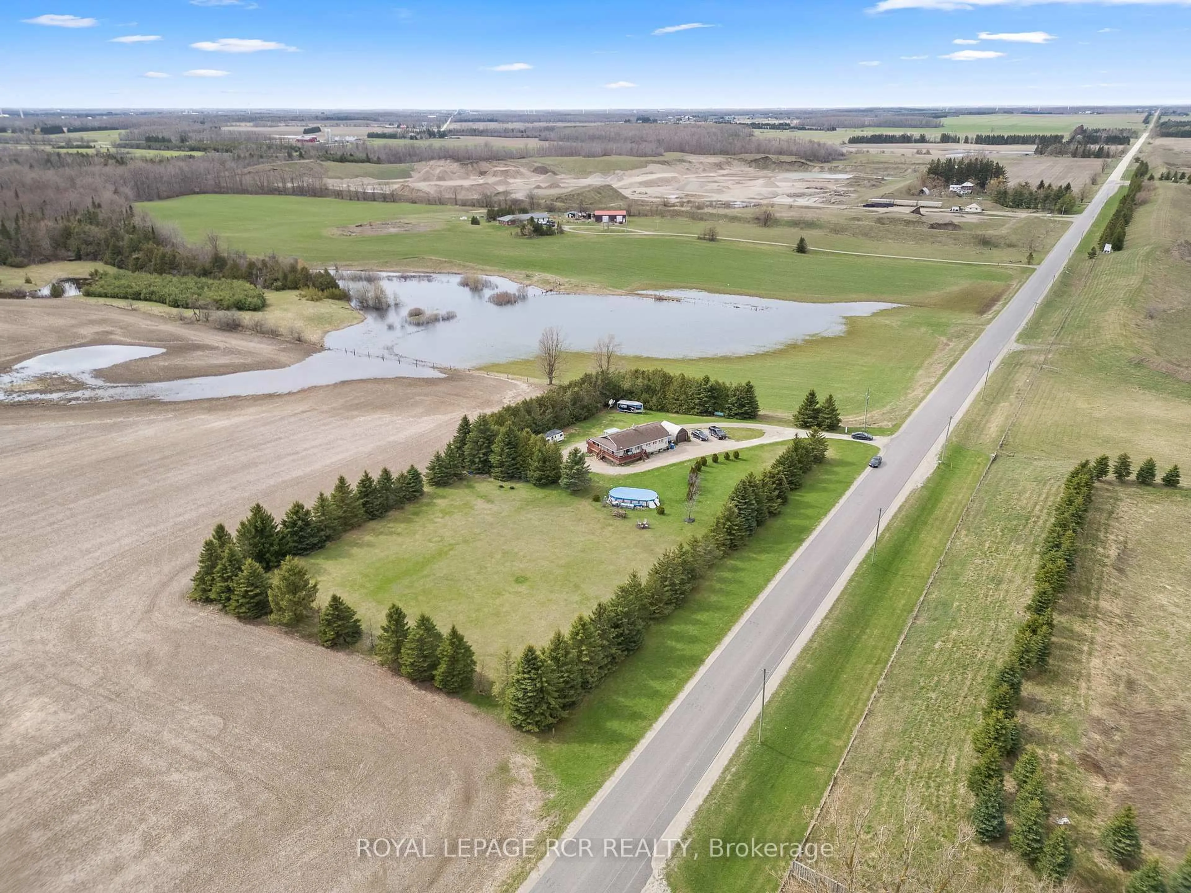 A pic from outside/outdoor area/front of a property/back of a property/a pic from drone, water/lake/river/ocean view for 437090 4th Line, Melancthon Ontario L9V 1S7