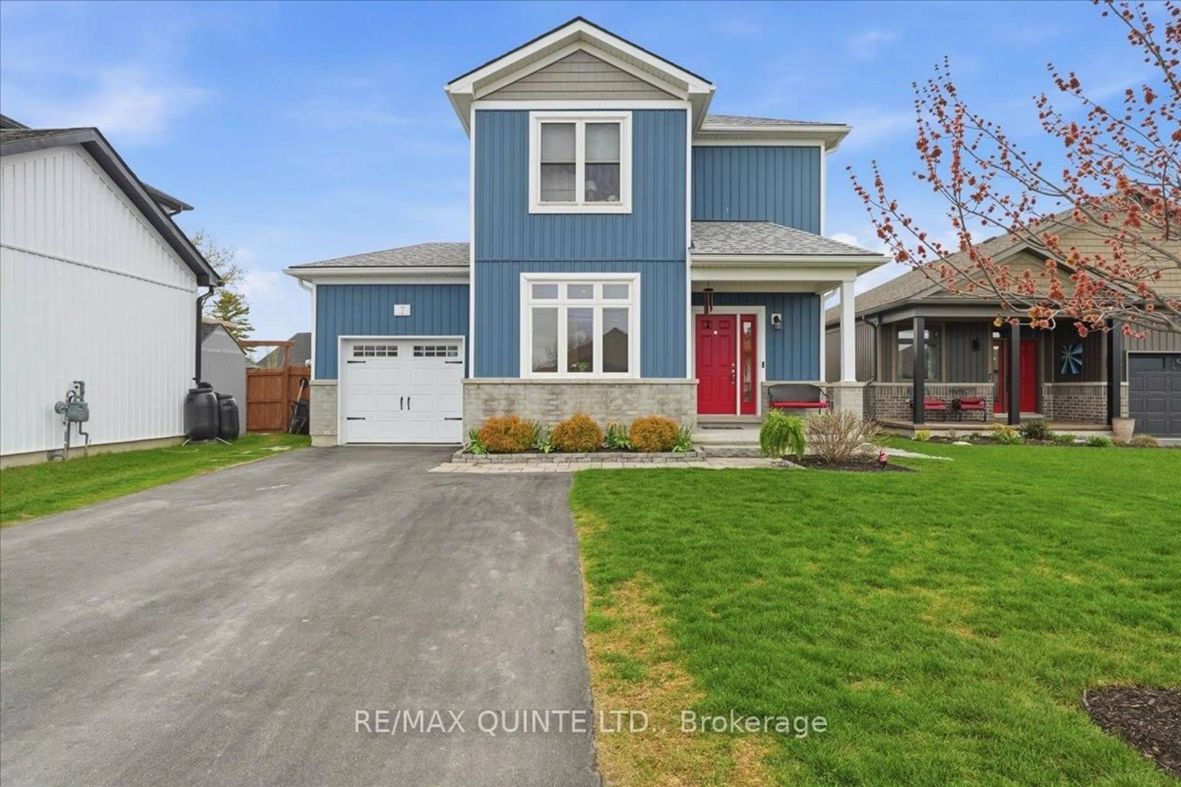 Home with vinyl exterior material, street for 7 Curtis St, Prince Edward County Ontario K0K 2T0