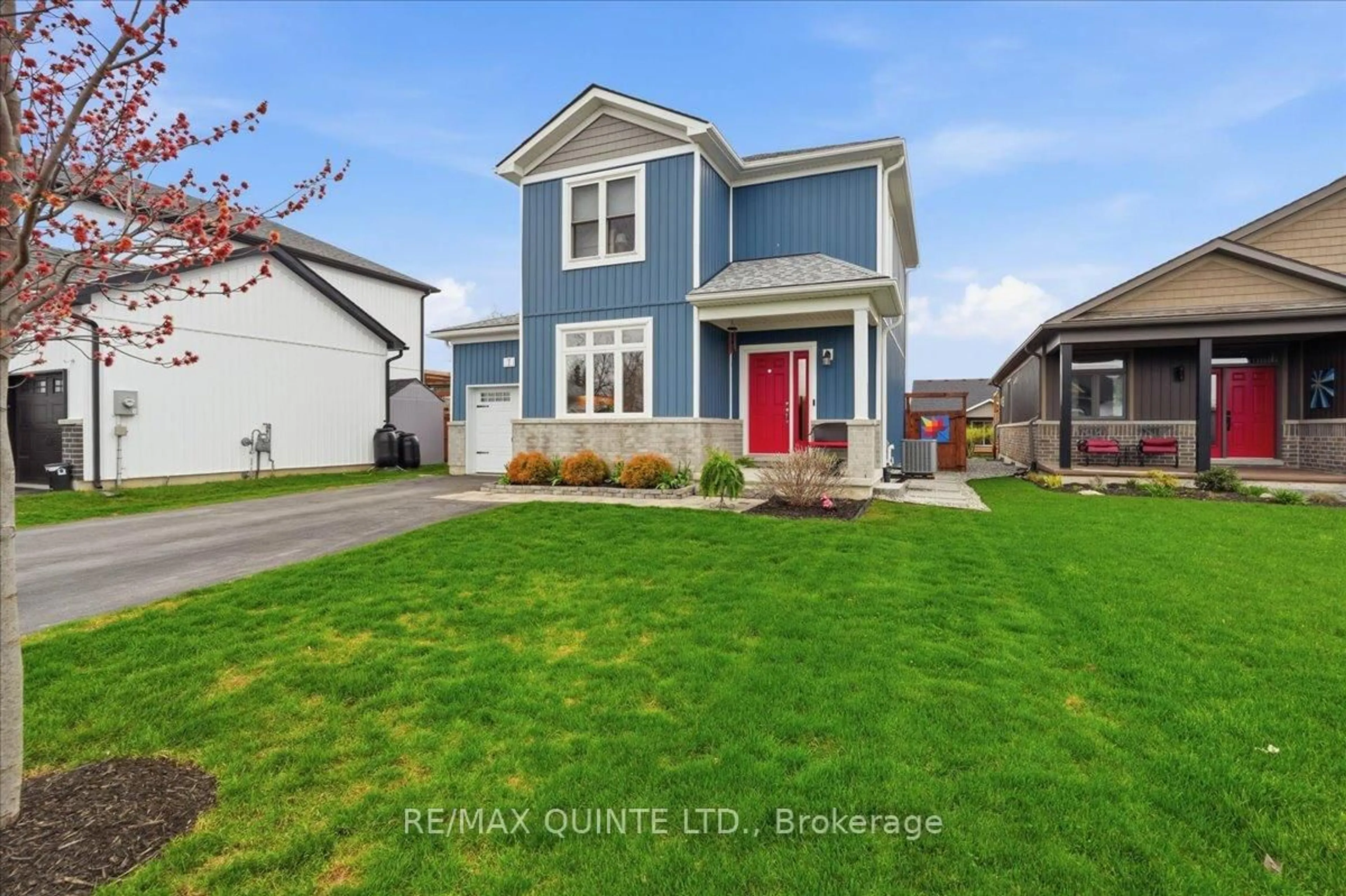 Home with vinyl exterior material, street for 7 Curtis St, Prince Edward County Ontario K0K 2T0