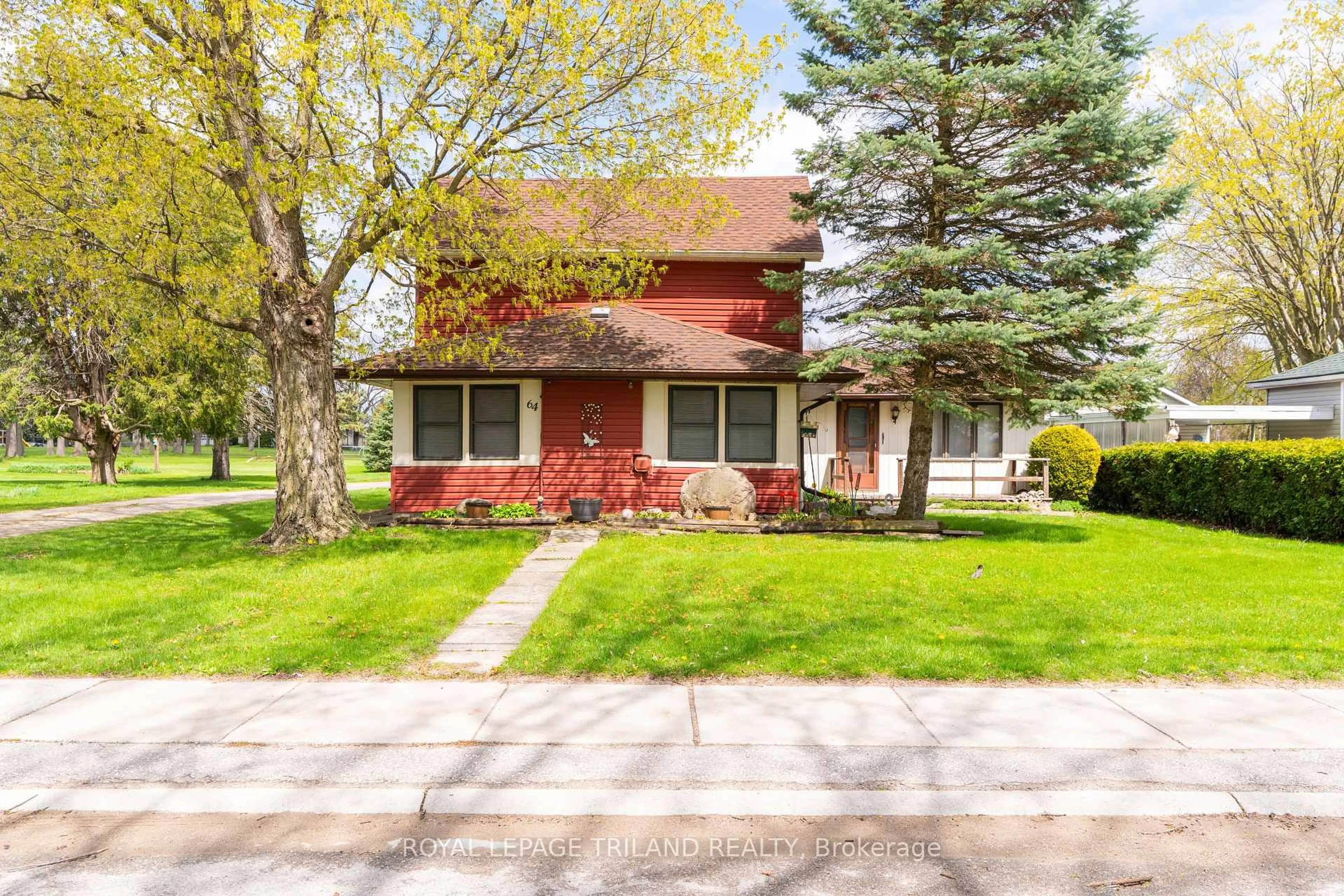 Home with vinyl exterior material, street for 64 Wellington Ave, Southwest Middlesex Ontario N0L 1A0