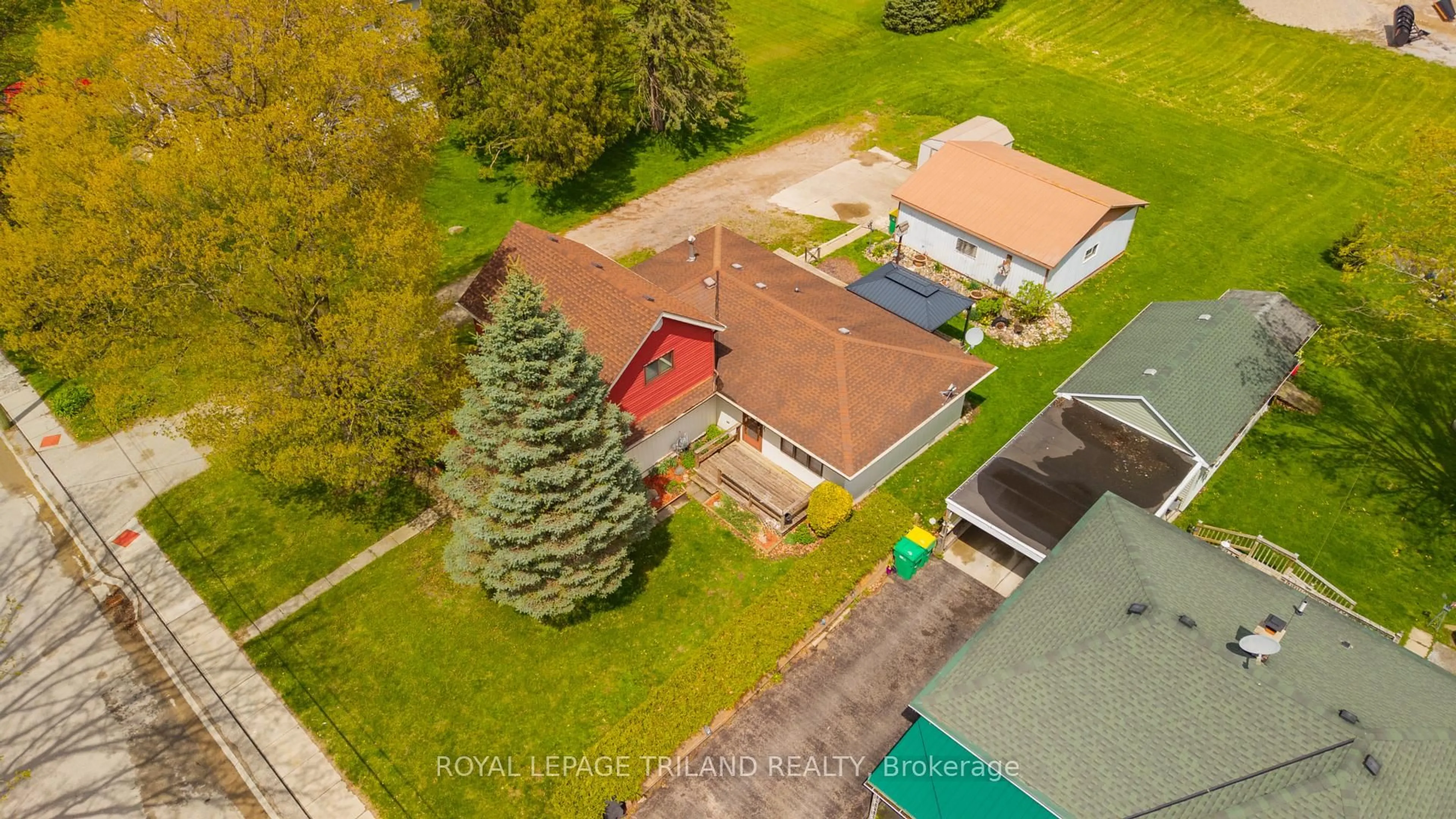 A pic from outside/outdoor area/front of a property/back of a property/a pic from drone, street for 64 Wellington Ave, Southwest Middlesex Ontario N0L 1A0