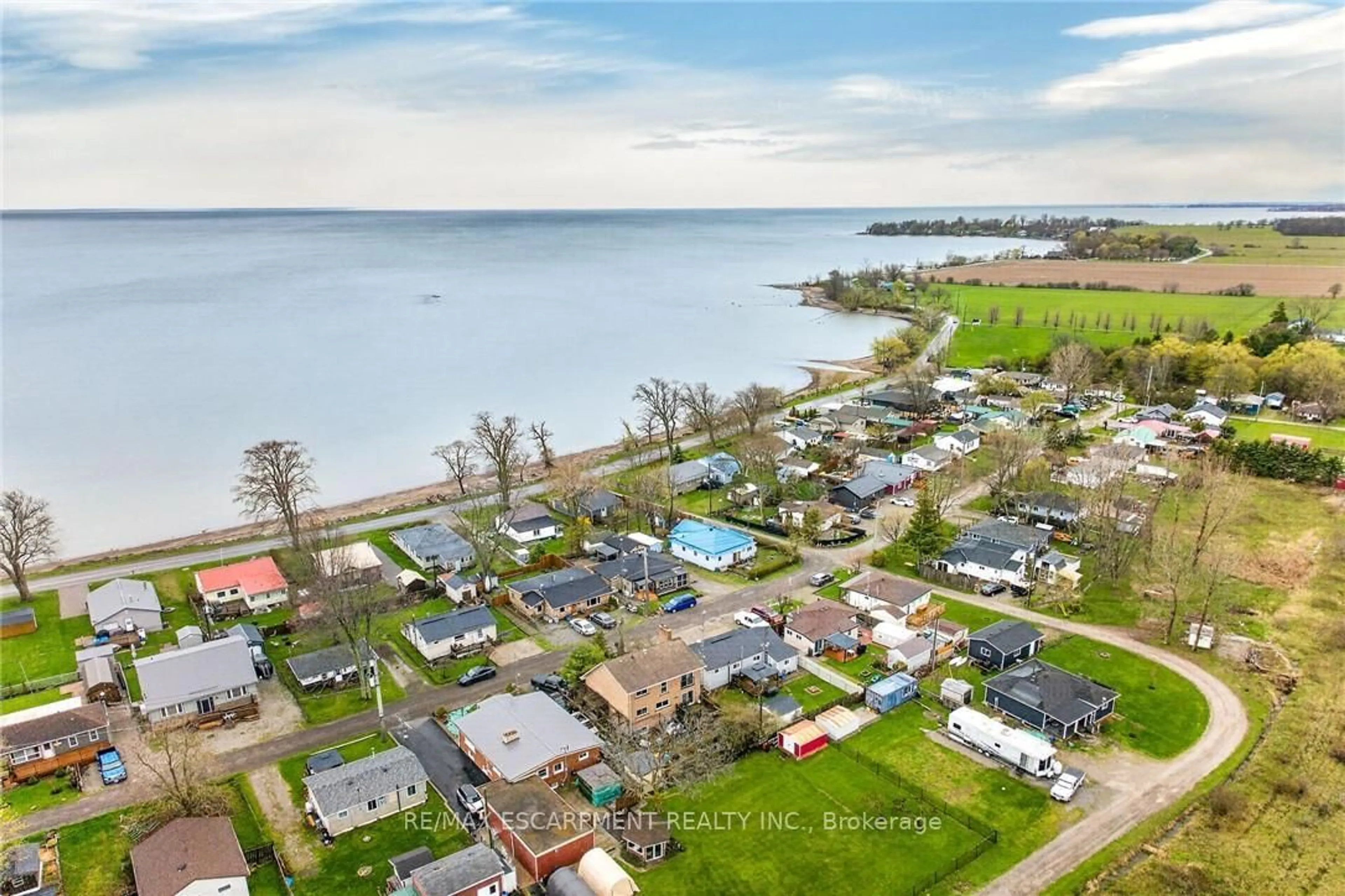 A pic from outside/outdoor area/front of a property/back of a property/a pic from drone, water/lake/river/ocean view for 25 Melville Lane, Haldimand Ontario N0A 1P0