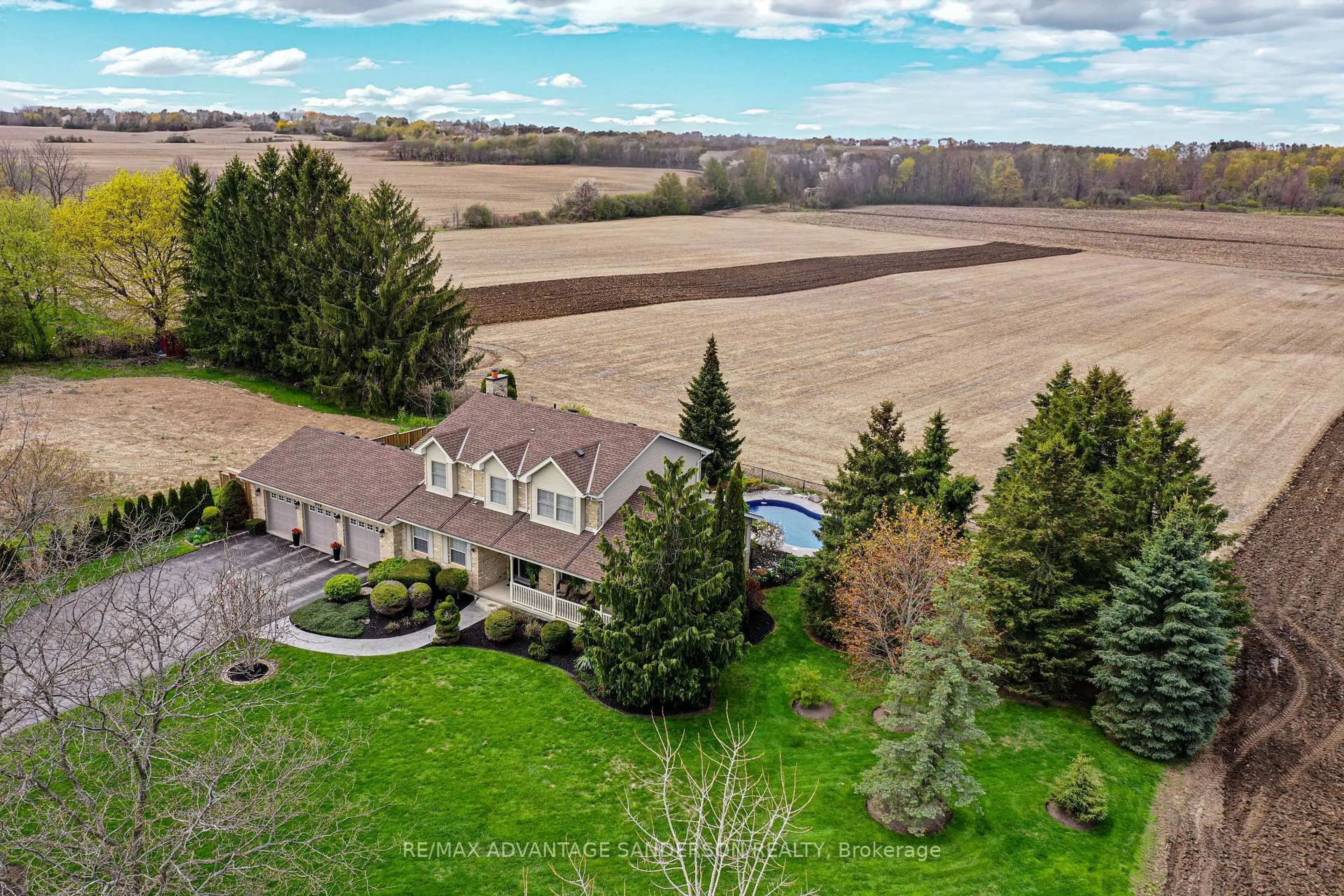 A pic from outside/outdoor area/front of a property/back of a property/a pic from drone, water/lake/river/ocean view for 975 Sunningdale Rd, London North Ontario N6G 5B7