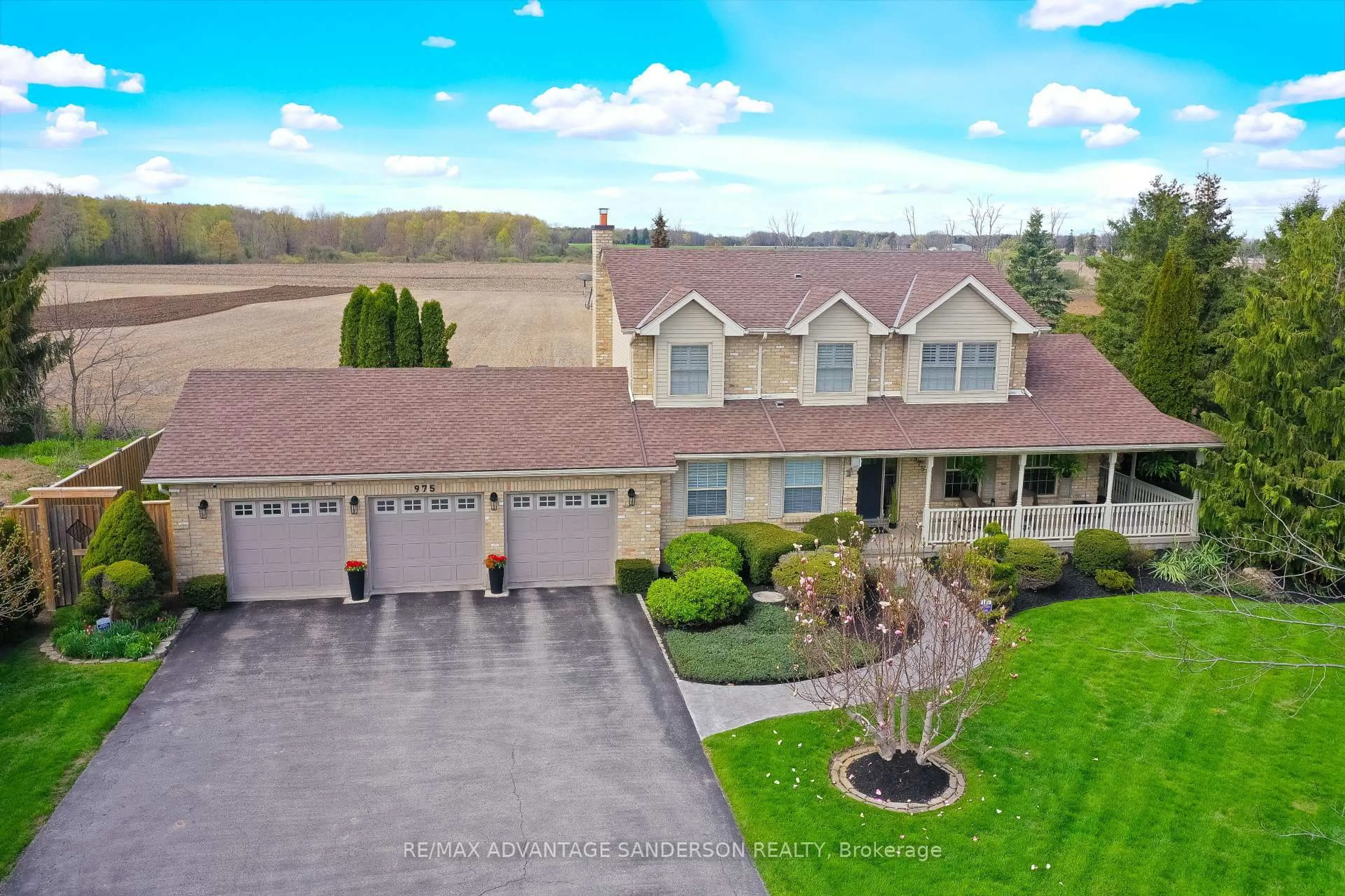 A pic from outside/outdoor area/front of a property/back of a property/a pic from drone, unknown for 975 Sunningdale Rd, London North Ontario N6G 5B7