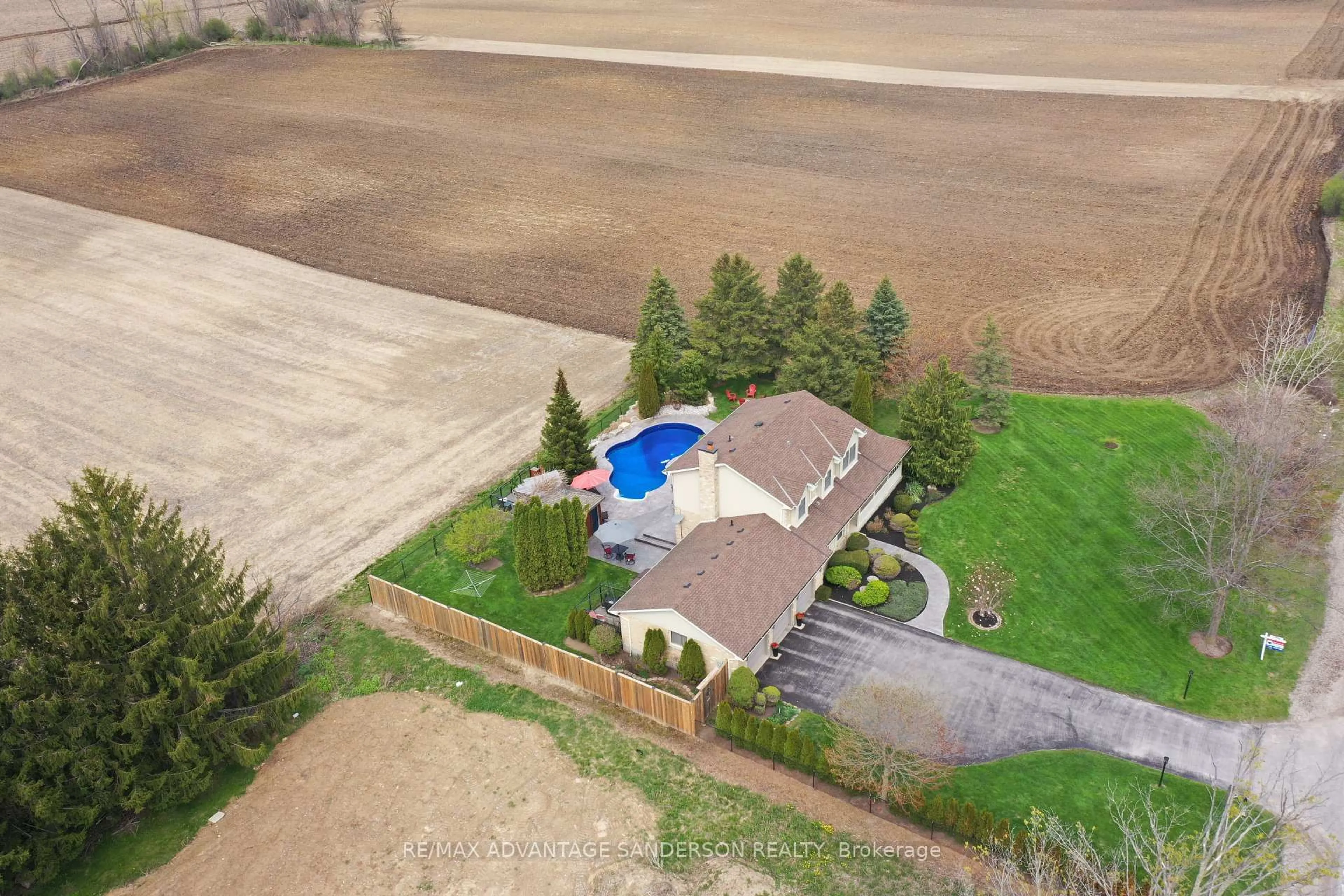 A pic from outside/outdoor area/front of a property/back of a property/a pic from drone, water/lake/river/ocean view for 975 Sunningdale Rd, London North Ontario N6G 5B7