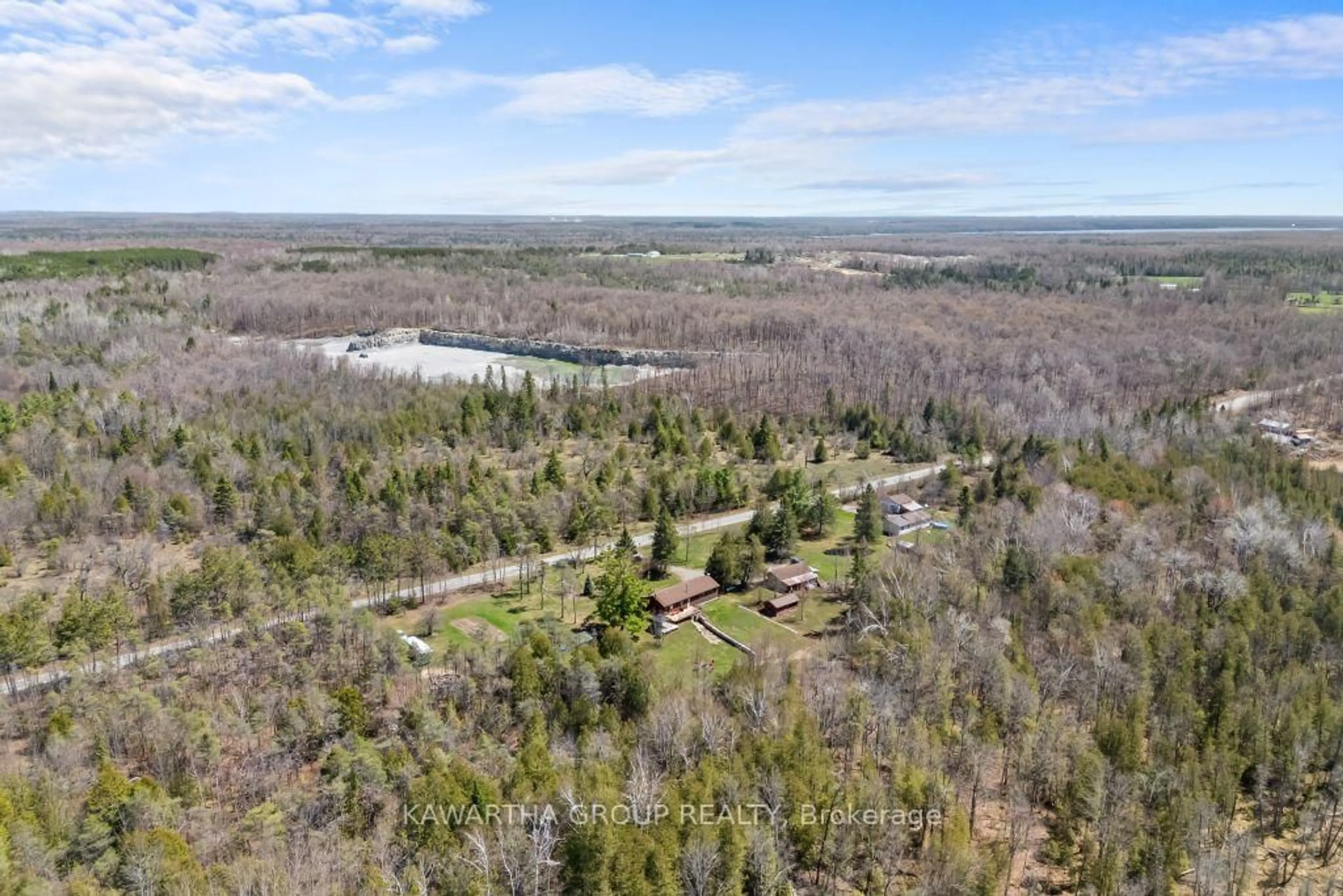 A pic from outside/outdoor area/front of a property/back of a property/a pic from drone, forest/trees view for 1057 Base Line Rd, Kawartha Lakes Ontario K0M 1K0