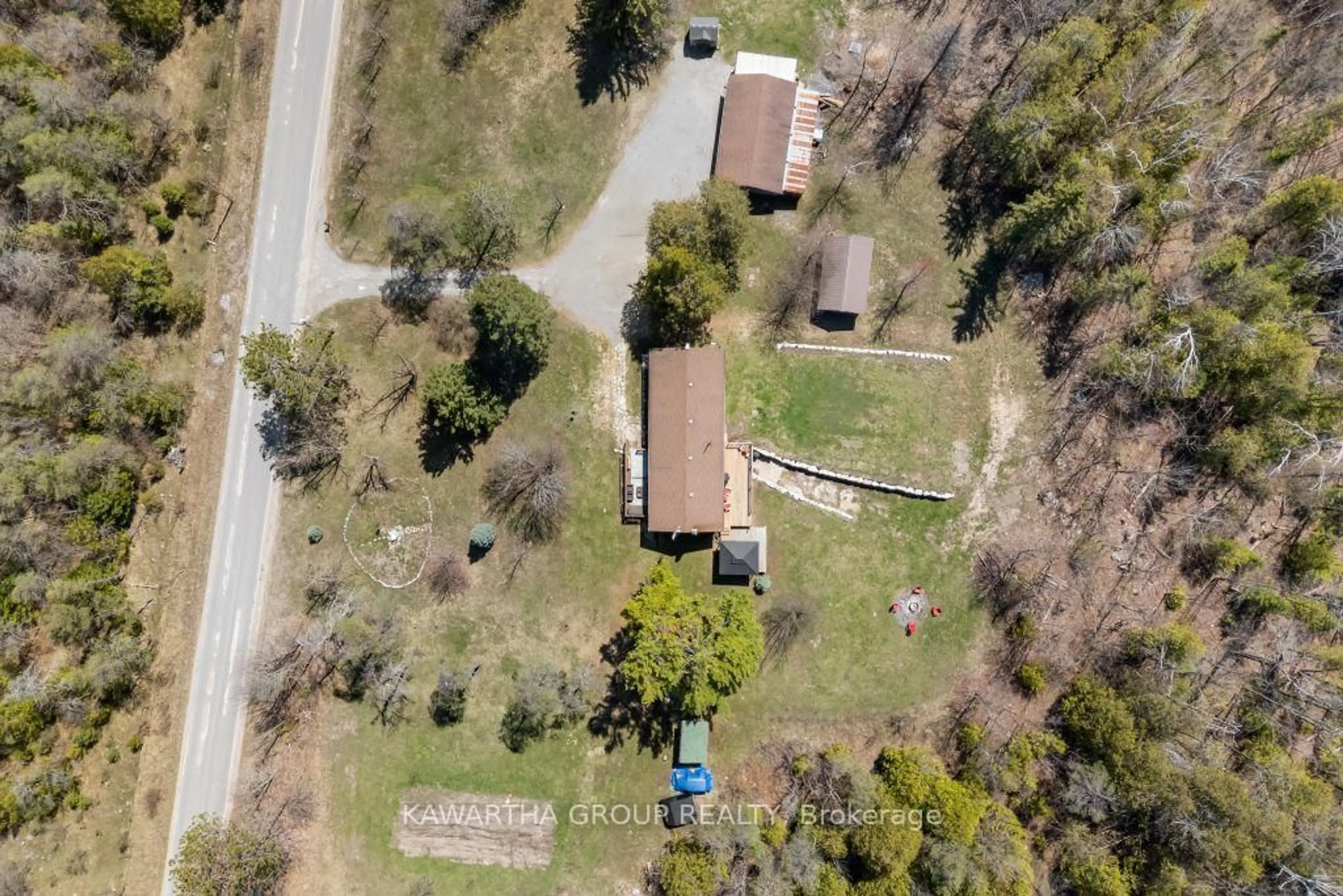 A pic from outside/outdoor area/front of a property/back of a property/a pic from drone, street for 1057 Base Line Rd, Kawartha Lakes Ontario K0M 1K0