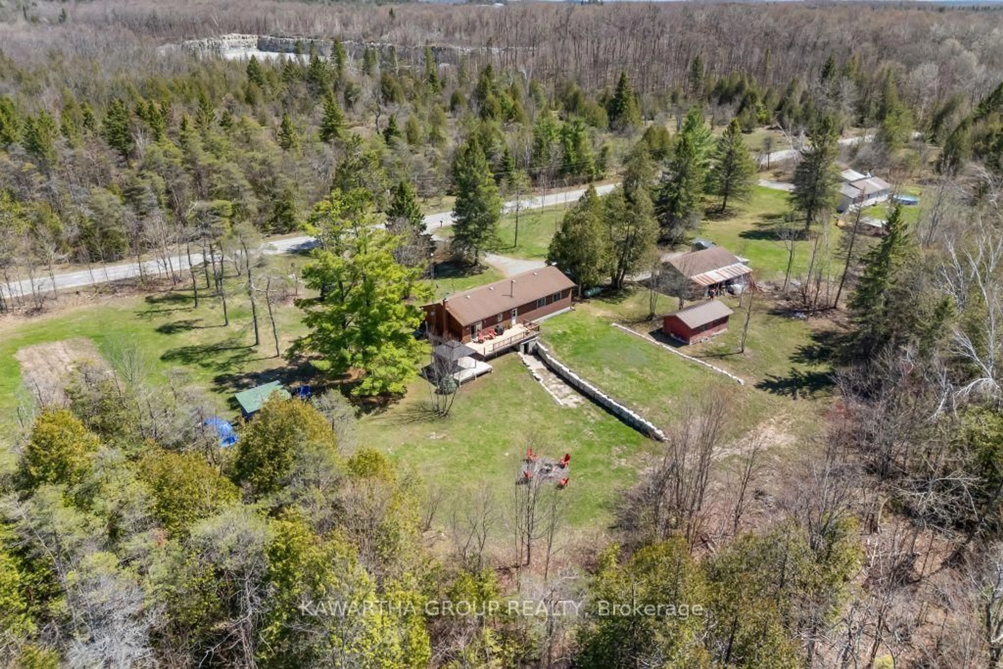 A pic from outside/outdoor area/front of a property/back of a property/a pic from drone, forest/trees view for 1057 Base Line Rd, Kawartha Lakes Ontario K0M 1K0