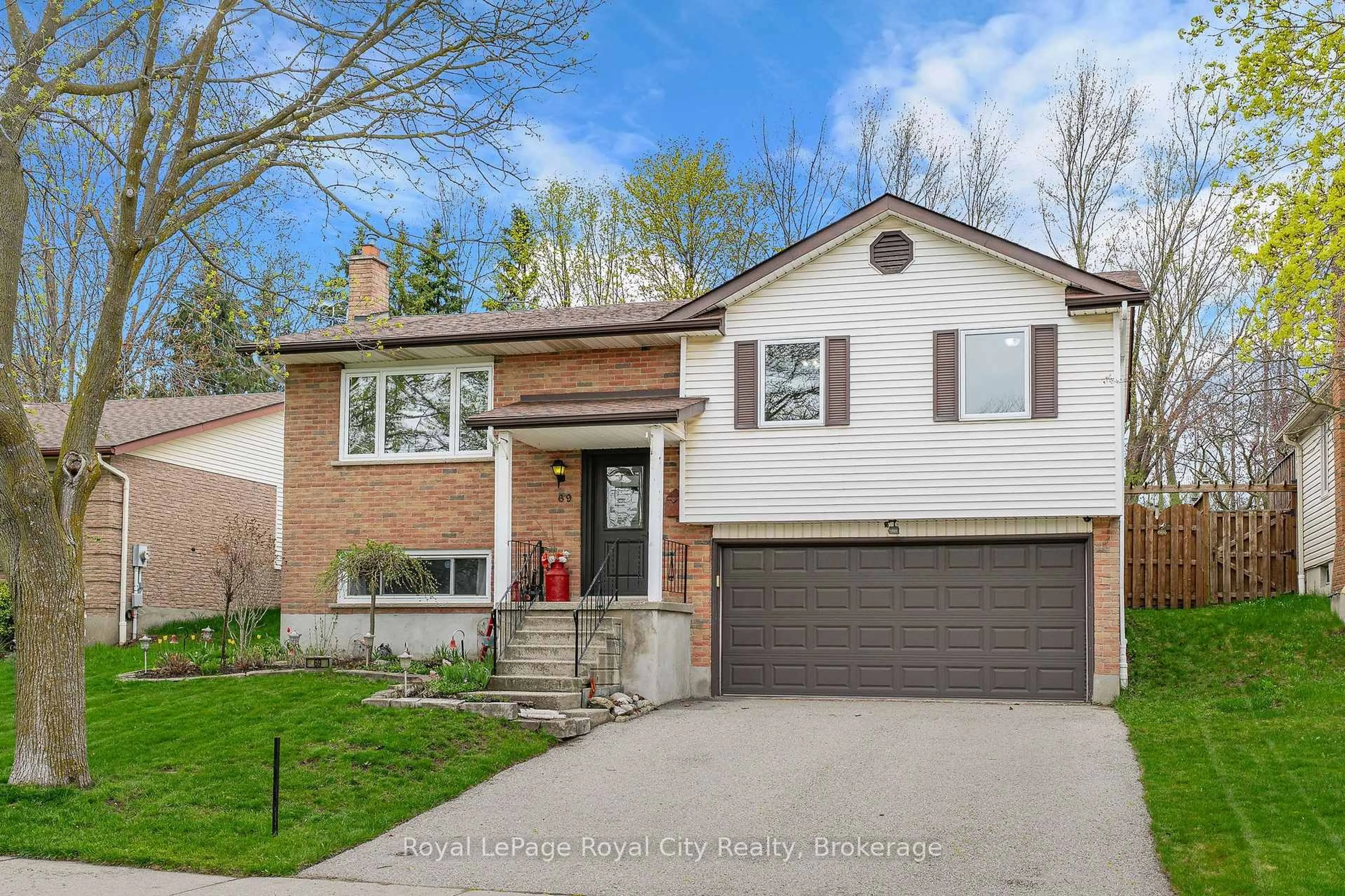 Home with brick exterior material, street for 69 Sanderson Dr, Guelph Ontario N1H 7K1