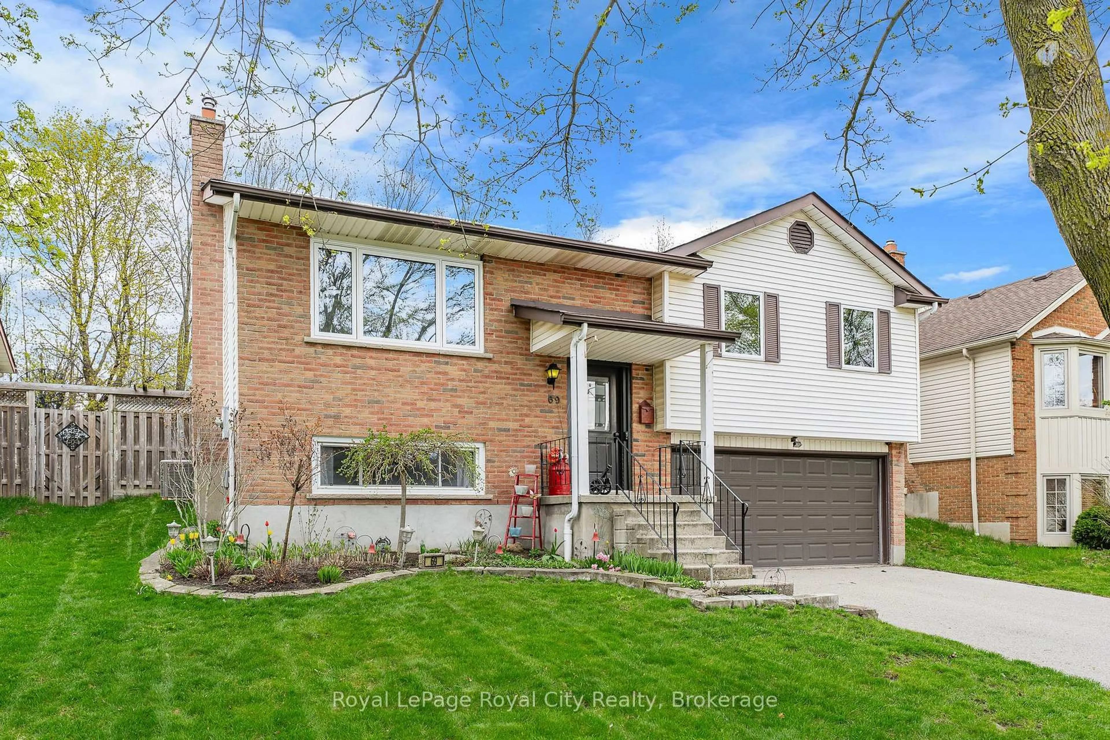 Home with brick exterior material, street for 69 Sanderson Dr, Guelph Ontario N1H 7K1