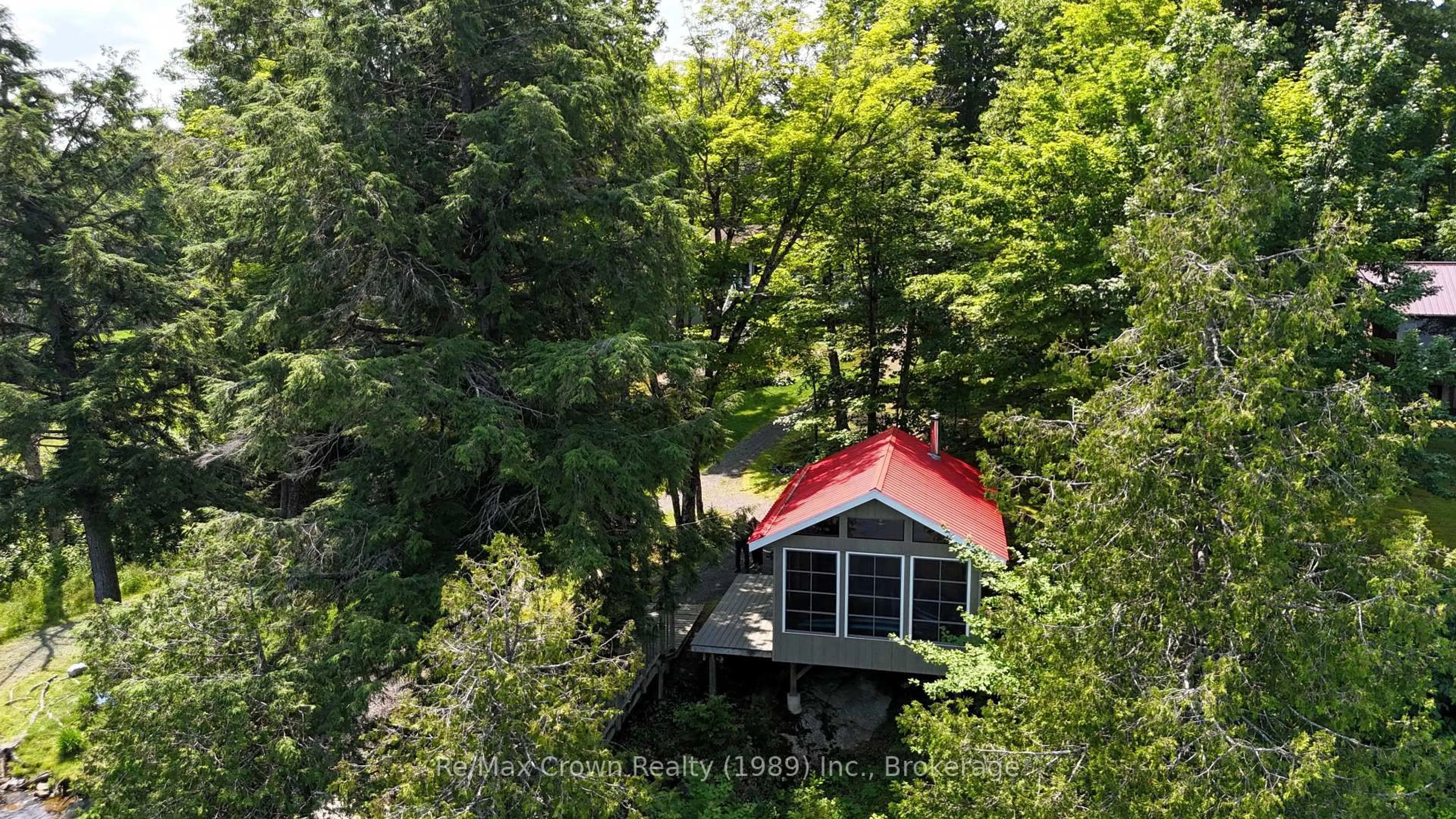 A pic from outside/outdoor area/front of a property/back of a property/a pic from drone, forest/trees view for 108 Murphy Dr, Parry Sound Remote Area Ontario P0H 1N0