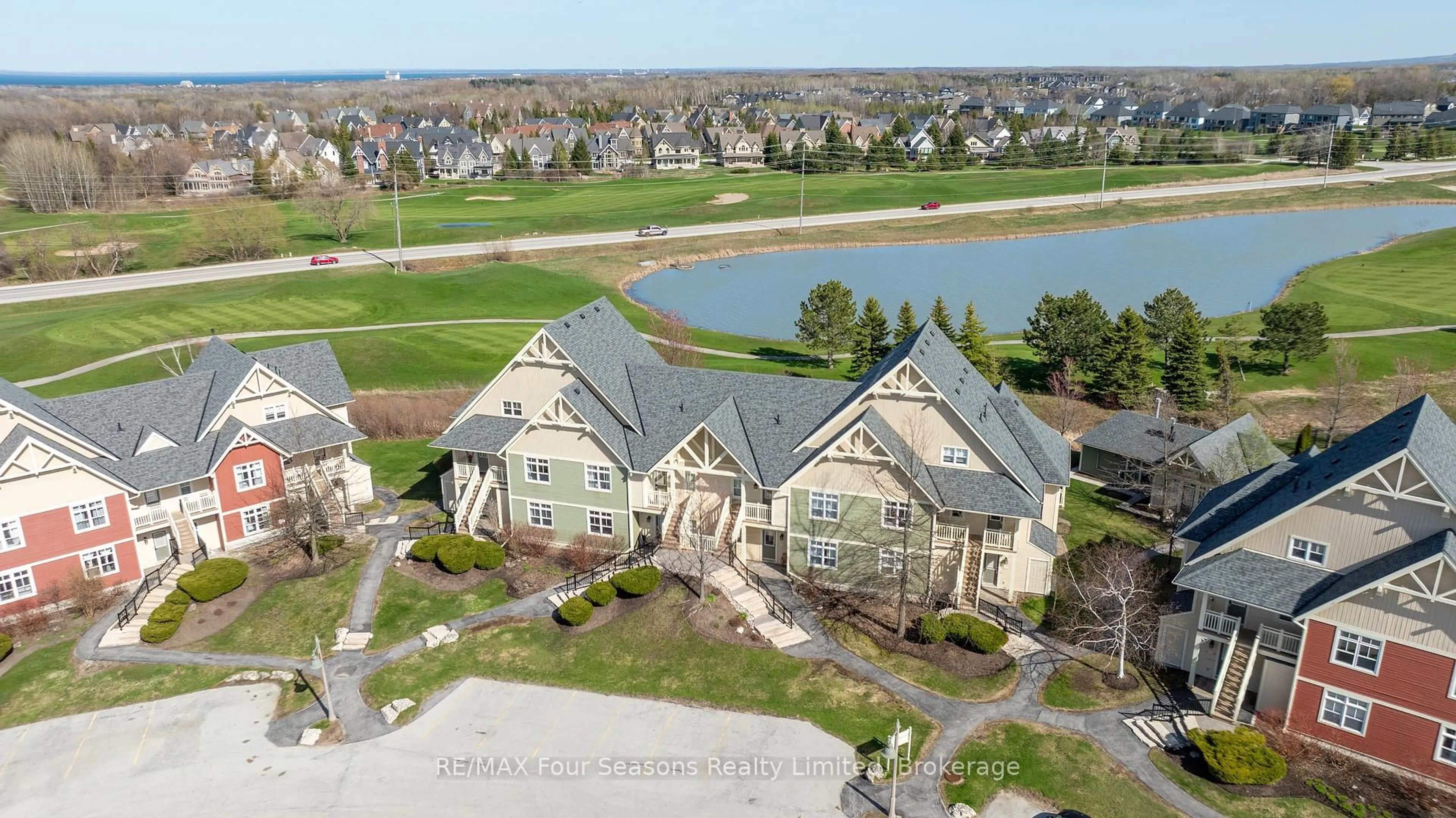A pic from outside/outdoor area/front of a property/back of a property/a pic from drone, water/lake/river/ocean view for 125 FAIRWAY Crt #125, Blue Mountains Ontario L9Y 0P8