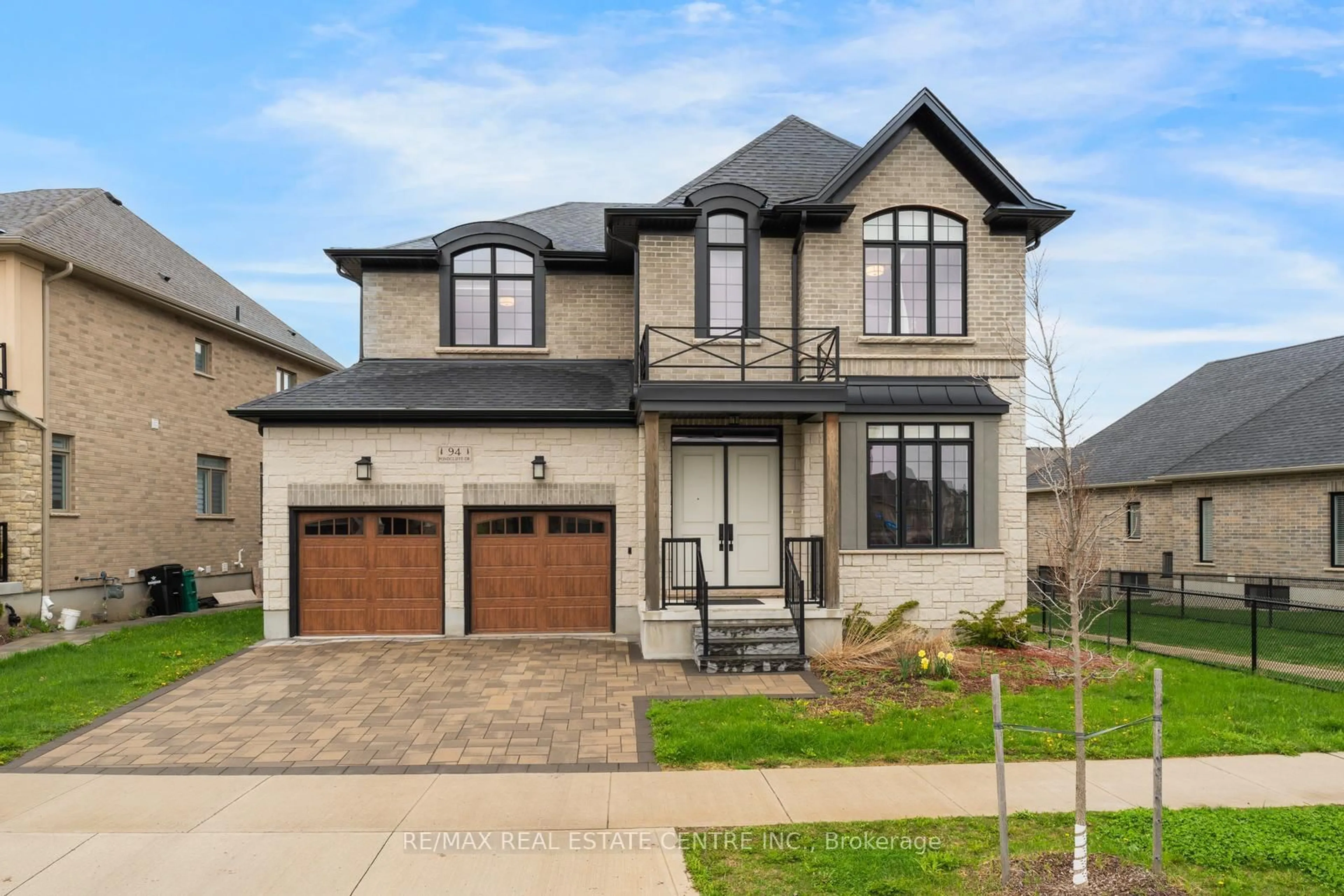 Home with brick exterior material, street for 94 Pondcliffe Dr, Kitchener Ontario N2R 0M3