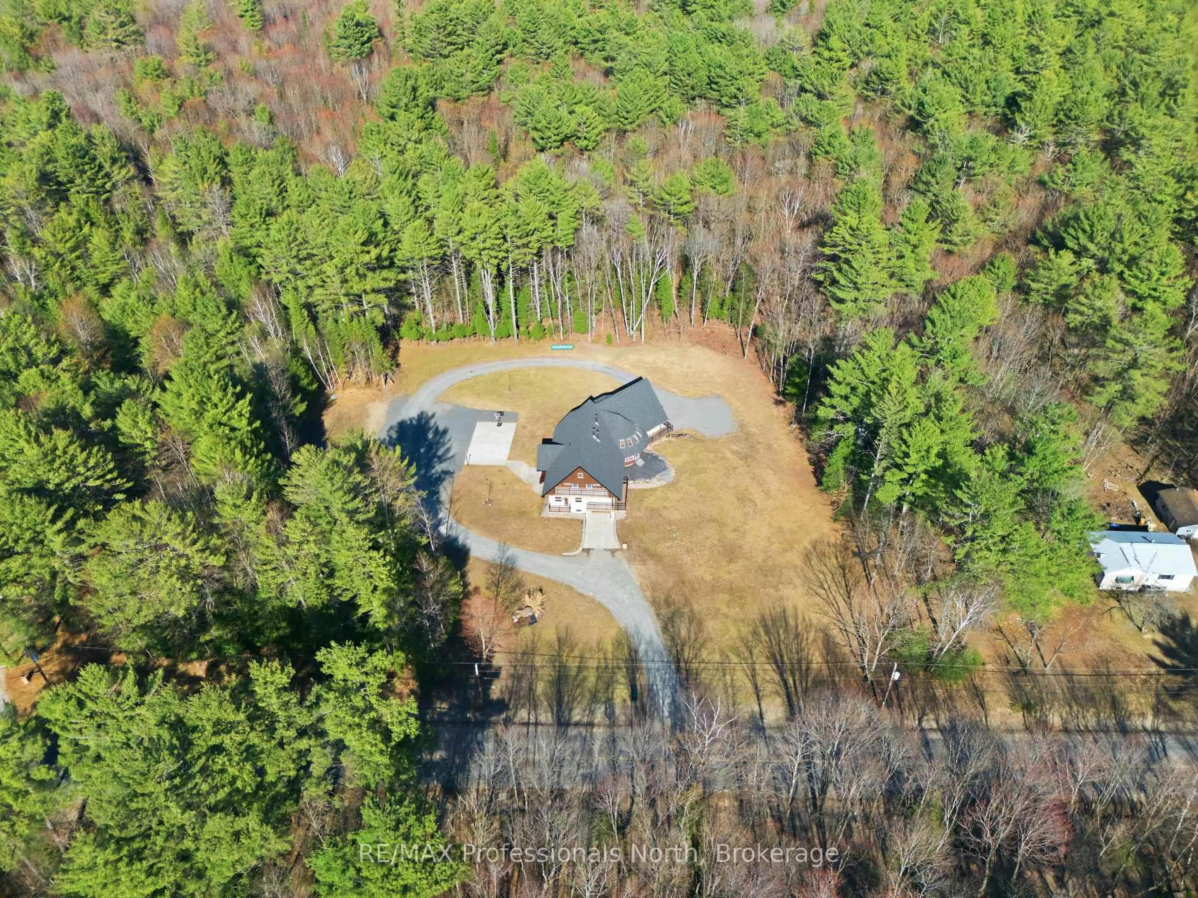 A pic from outside/outdoor area/front of a property/back of a property/a pic from drone, forest/trees view for 1196 Ravenscliffe Rd, Huntsville Ontario P1H 2N5