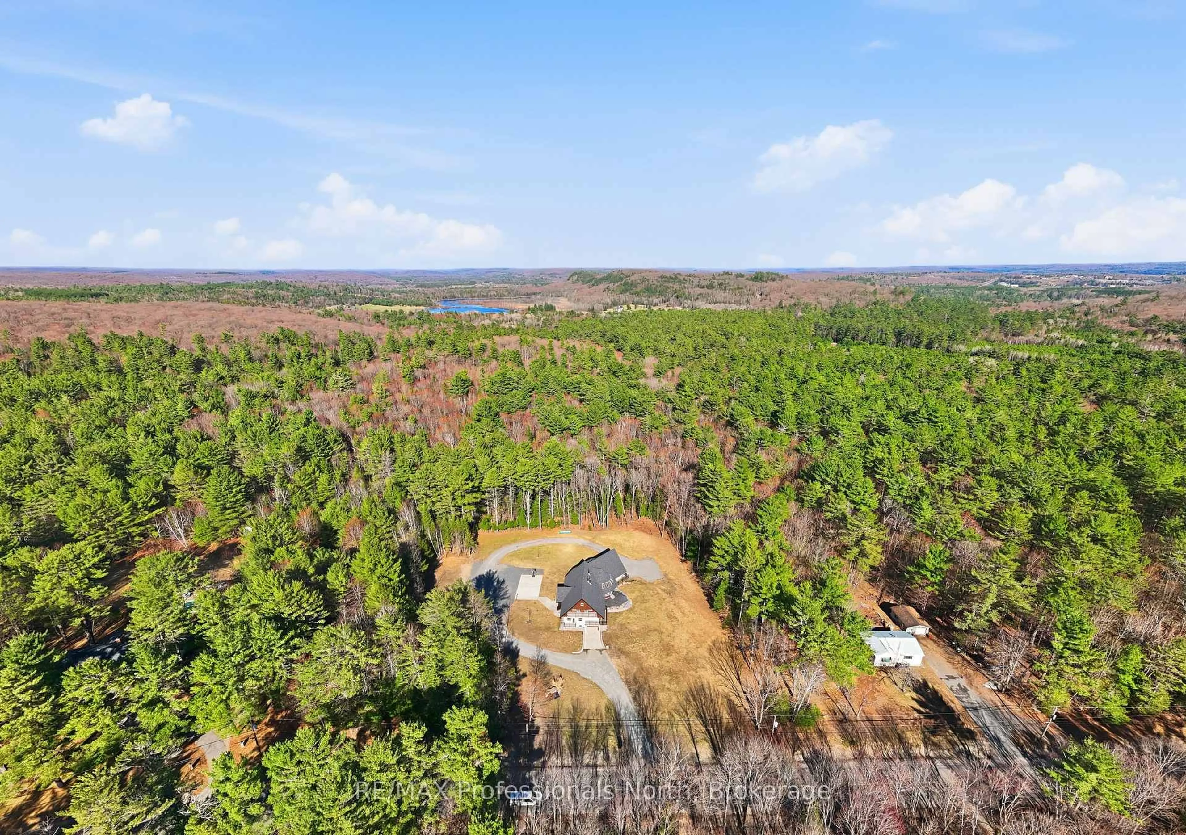 A pic from outside/outdoor area/front of a property/back of a property/a pic from drone, forest/trees view for 1196 Ravenscliffe Rd, Huntsville Ontario P1H 2N5