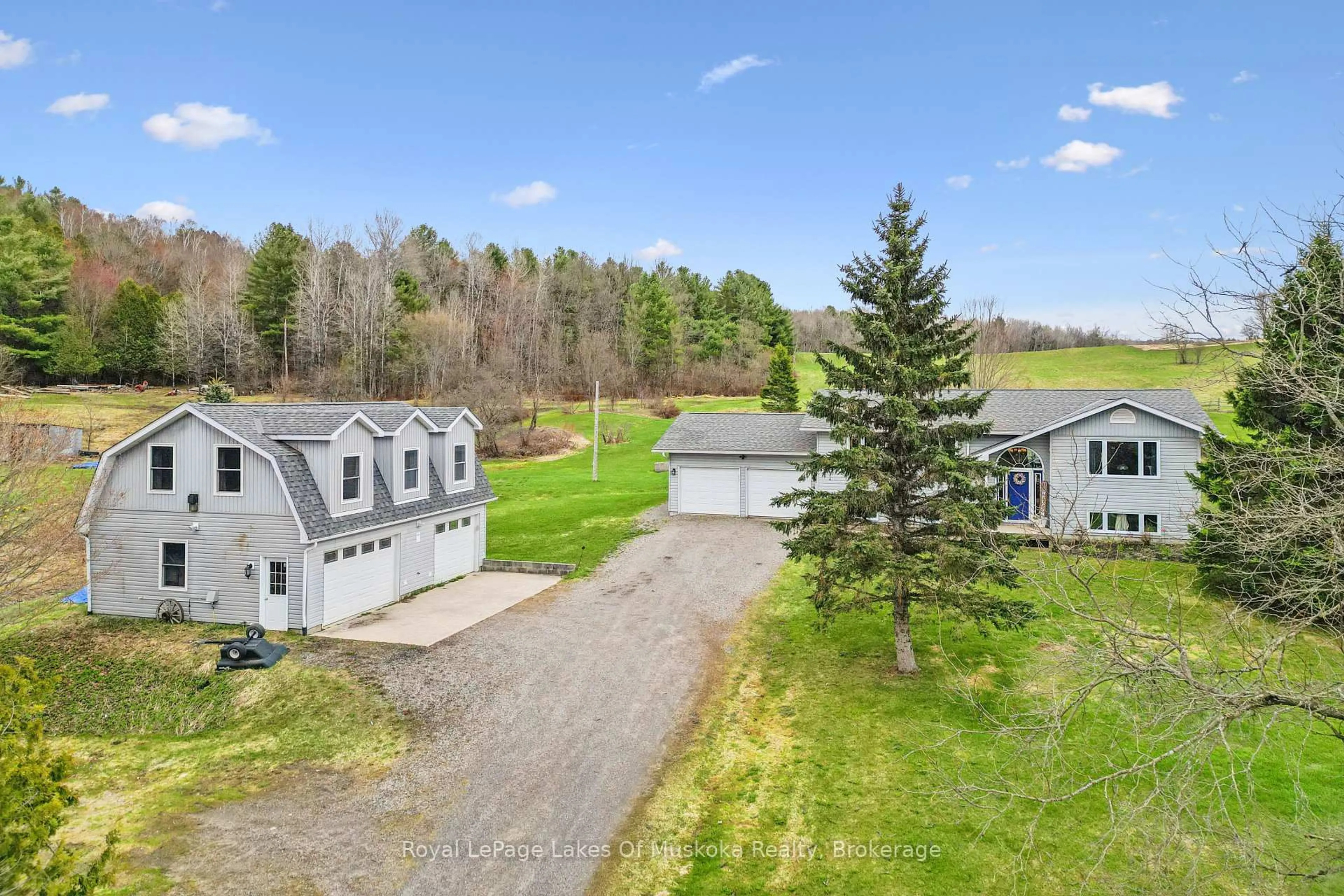 A pic from outside/outdoor area/front of a property/back of a property/a pic from drone, mountain view for 1089 Rosseau Lake 1 Rd, Muskoka Lakes Ontario P0B 1M0