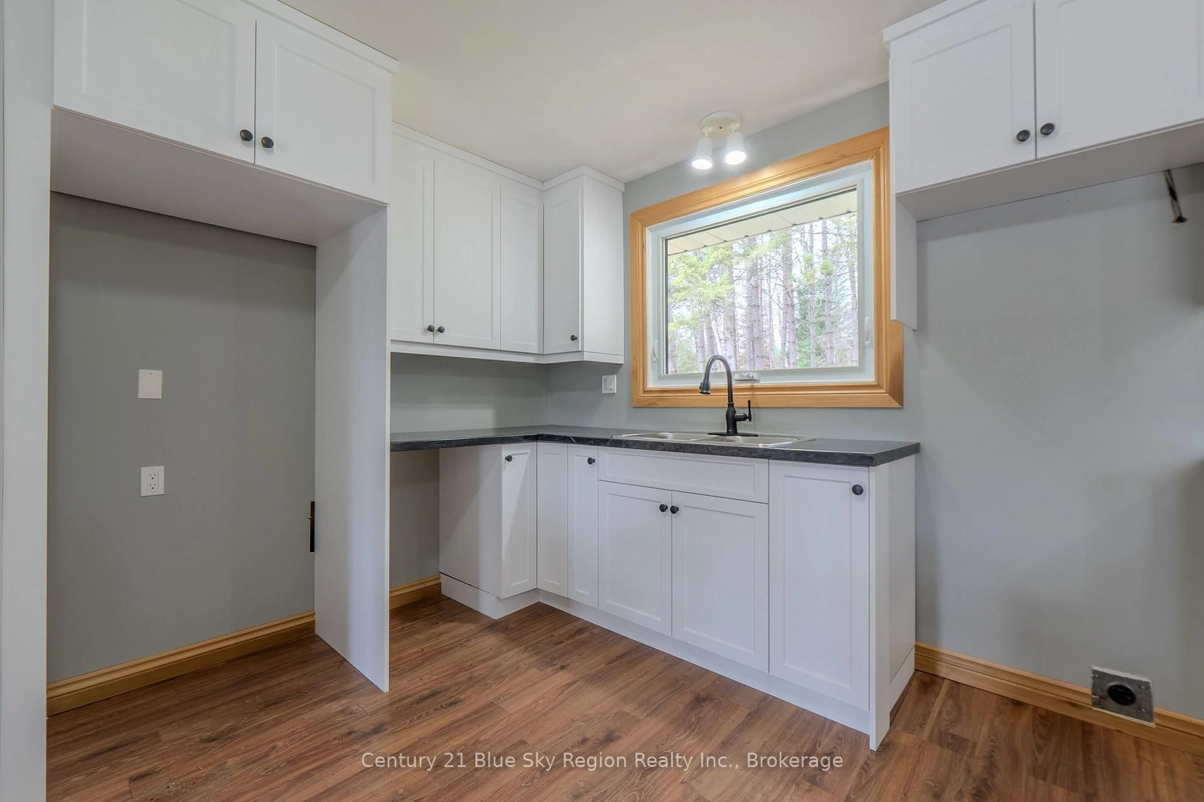Open concept kitchen, wood/laminate floor for 9510 Highway 63, Unorganized Townships Ontario P0H 2A0