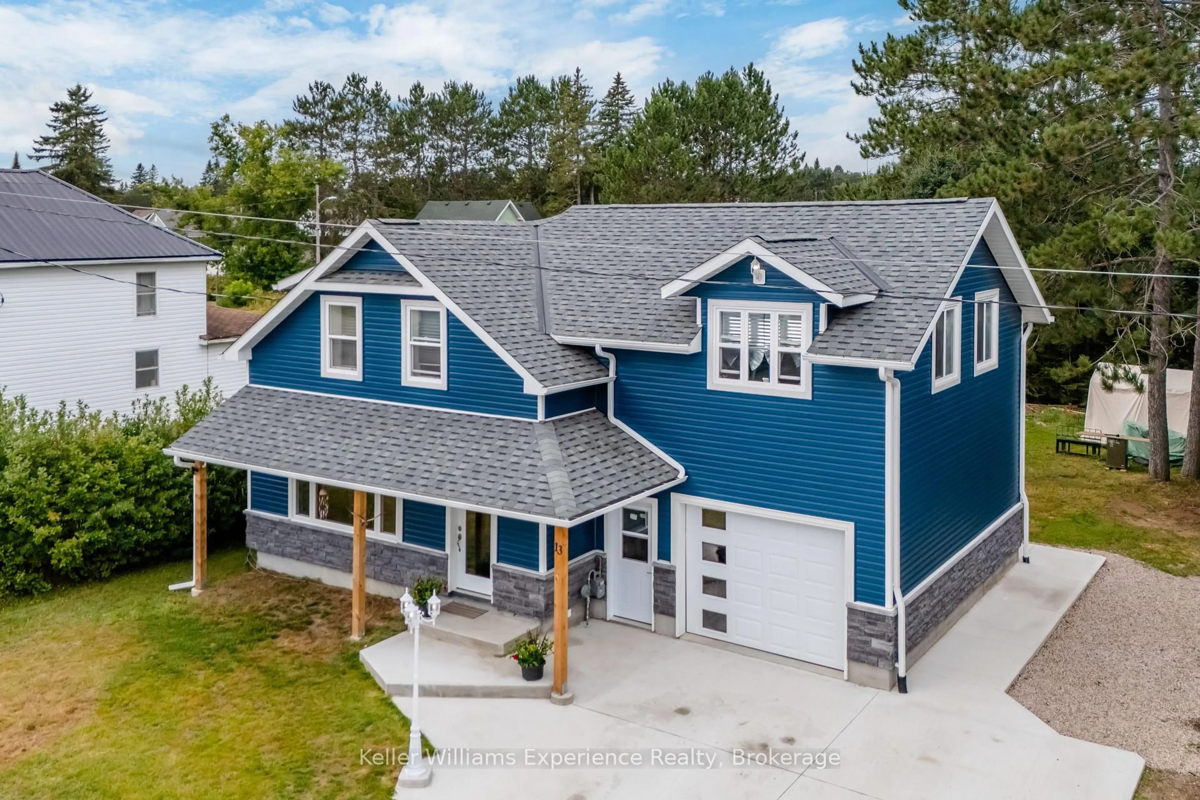 A pic from outside/outdoor area/front of a property/back of a property/a pic from drone, unknown for 13 Toronto Ave, South River Ontario P0A 1X0