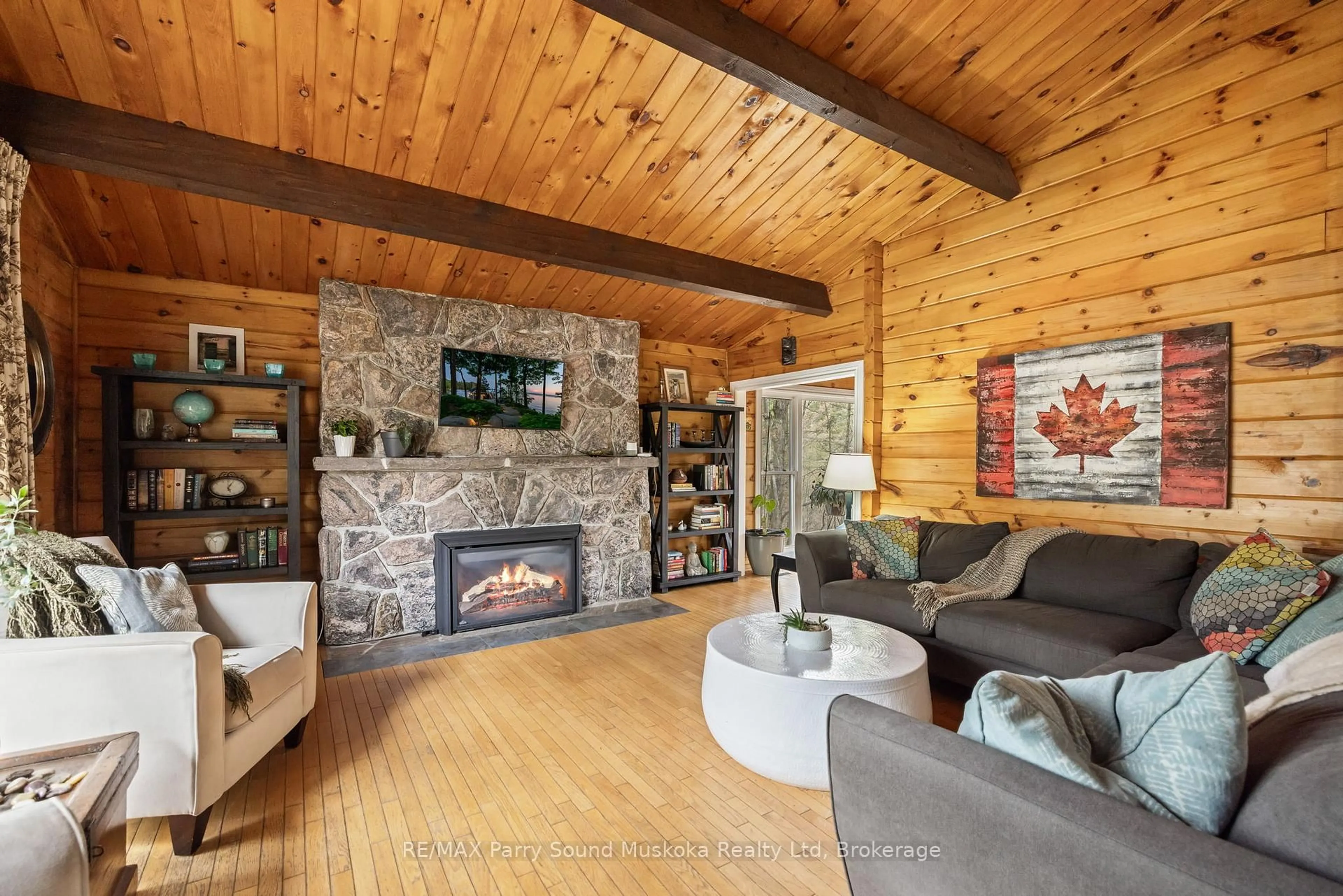 Living room with furniture, wood/laminate floor for 11 Brenda Ave, Parry Sound Ontario P2A 2Y9