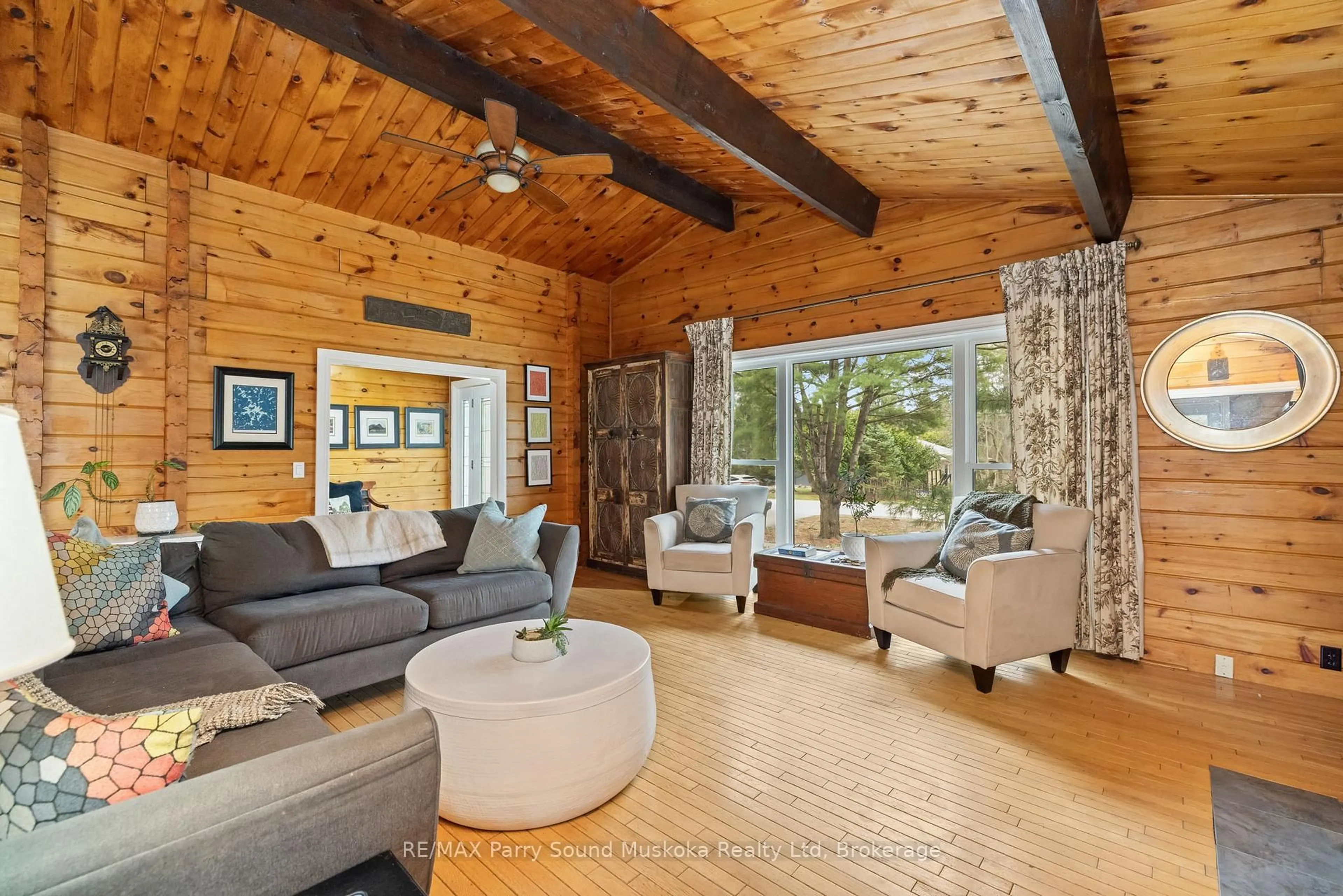 Living room with furniture, wood/laminate floor for 11 Brenda Ave, Parry Sound Ontario P2A 2Y9