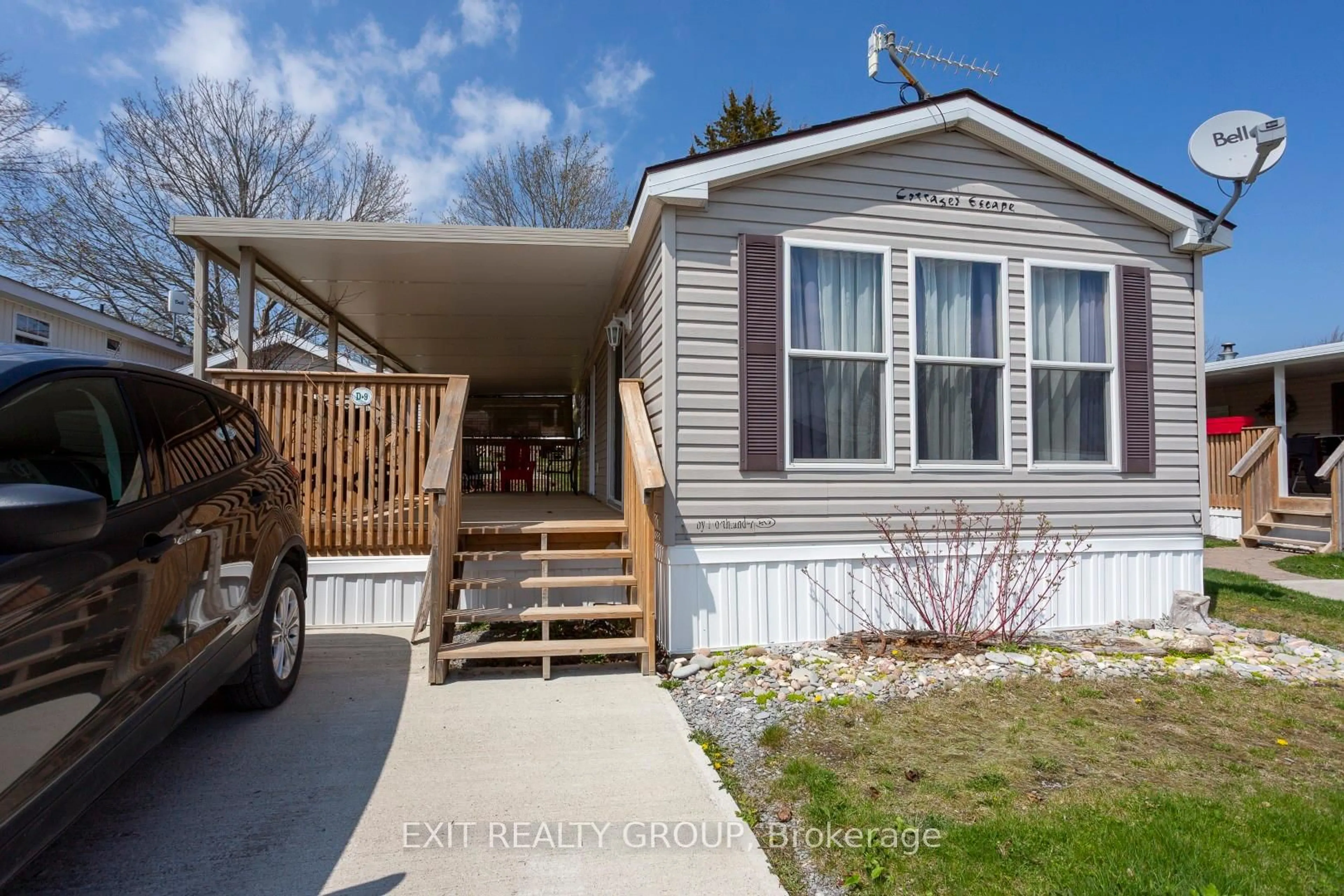 Home with vinyl exterior material, street for 153 County Road 27 ##D9, Prince Edward County Ontario K0K 1T0