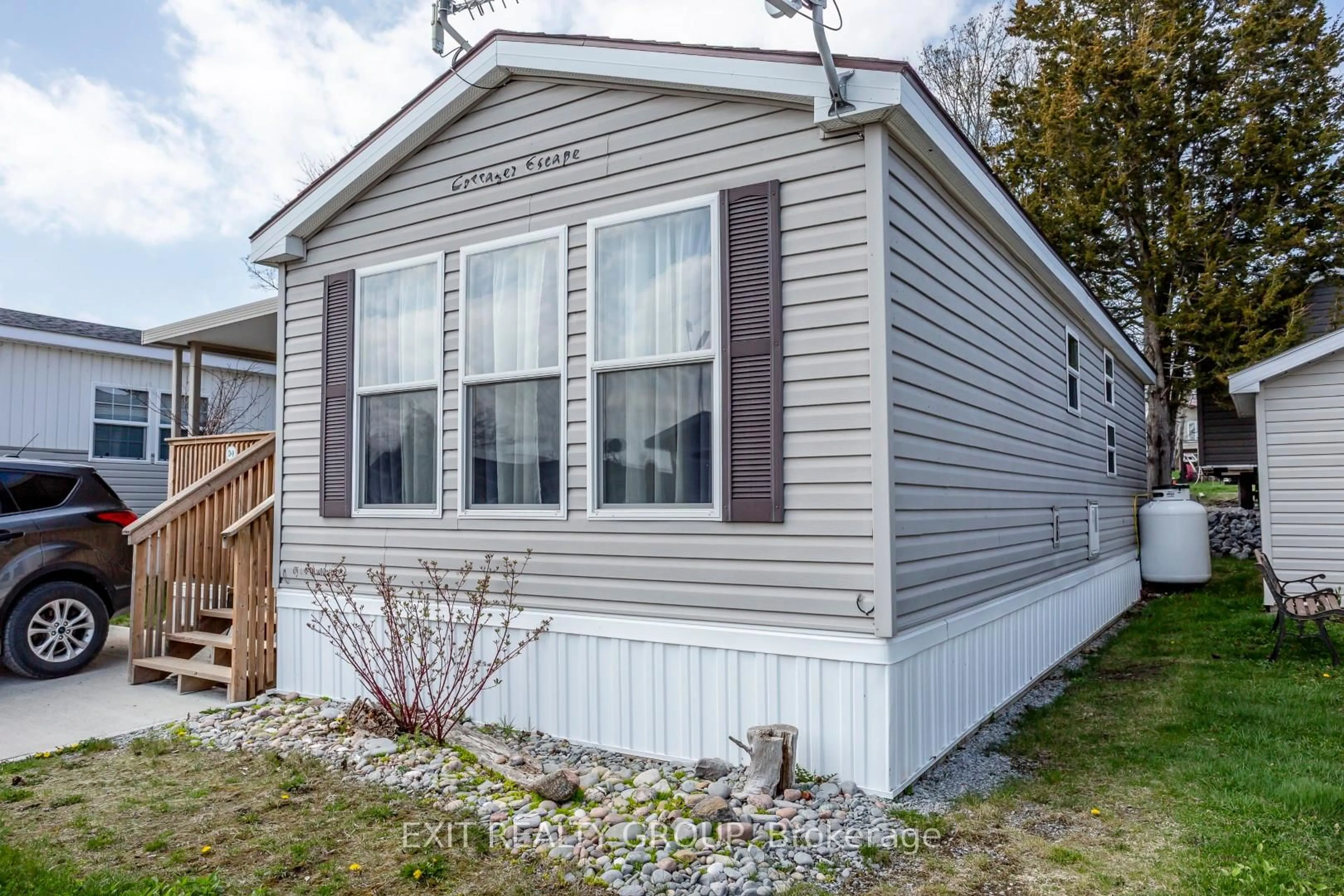 Home with vinyl exterior material, street for 153 County Road 27 ##D9, Prince Edward County Ontario K0K 1T0